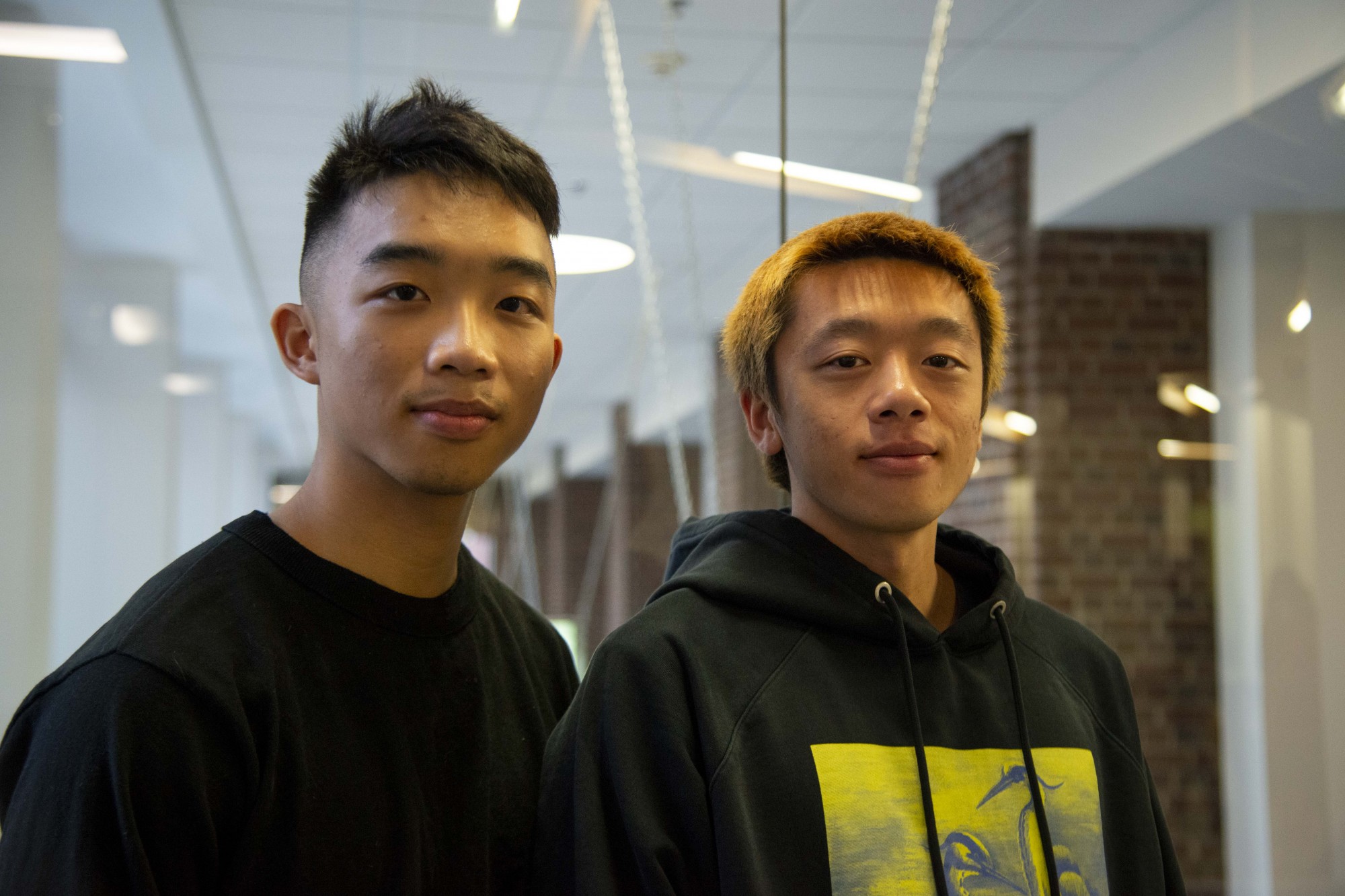 Students Stanley, left, and Dominic, right, pose for a portrait in Coffman Union on Friday, Dec. 6. 