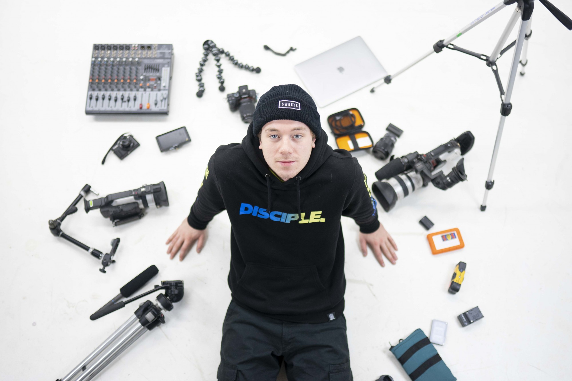 Cooper Eddy poses for a portrait with his video production equipment in his Minneapolis based Sweets Kendamas studio on Monday, Dec. 2. His job as a videographer allows him to create educational tutorials and film with other professionals on a regular basis. Eddy believes in social media as a way to connect with others who share a similar passion for Kendama. 