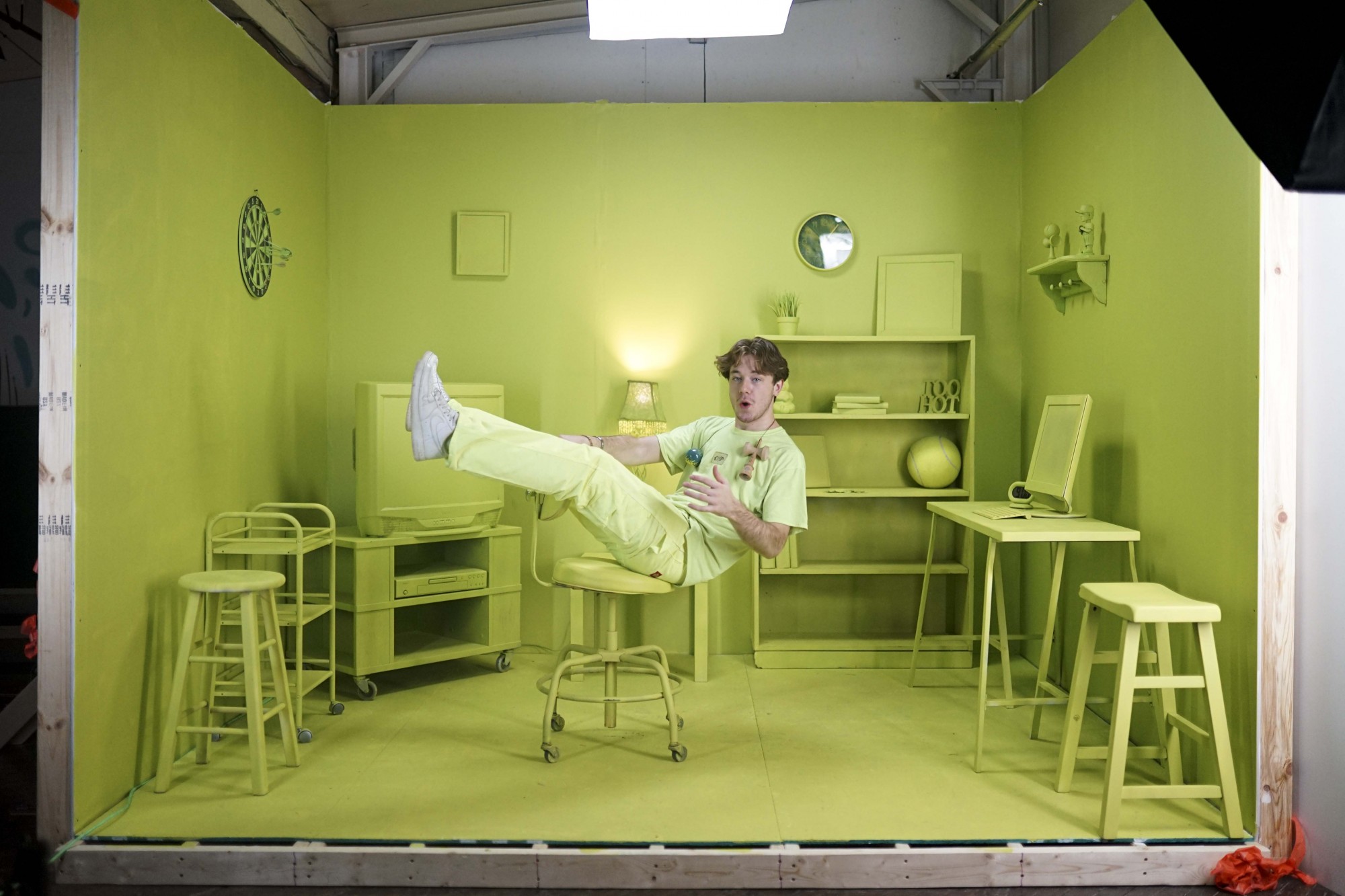 Eddy poses for a portrait in a custom built studio he designed to promote a new pro model Kendama on Monday, Nov. 18. A video he produced, Coop’s room, found inspiration from how common it is for many kids to play Kendama in their own room and the vibrant, green color of his new model. 