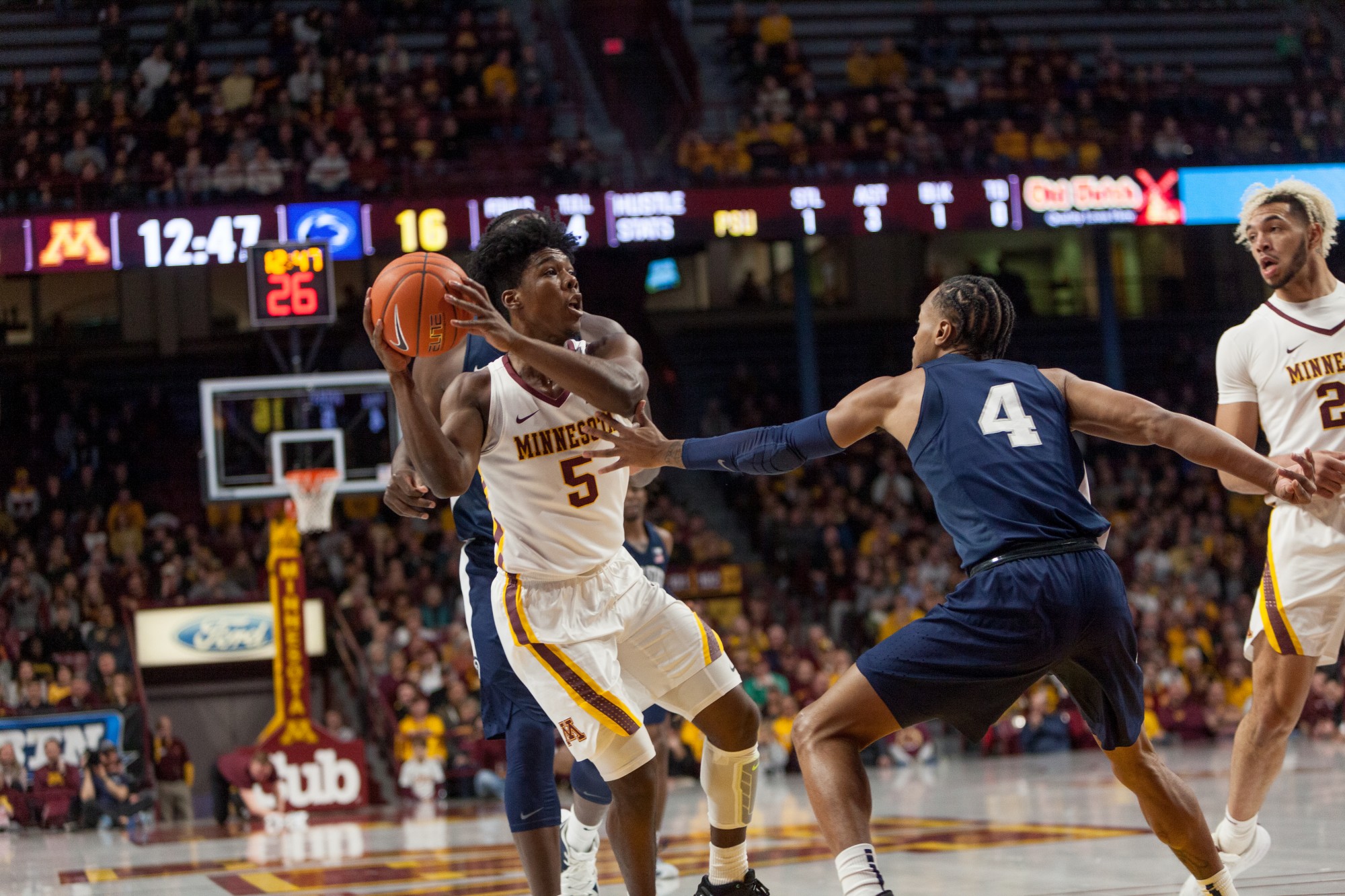 Gophers Guard Marcus Carr protects the ball from a defender at Williams Arena on Wednesday, Jan. 15.  Minnesota defeated the Penn State Nittany Lions 75-69. (Kamaan Richards / Minnesota Daily)