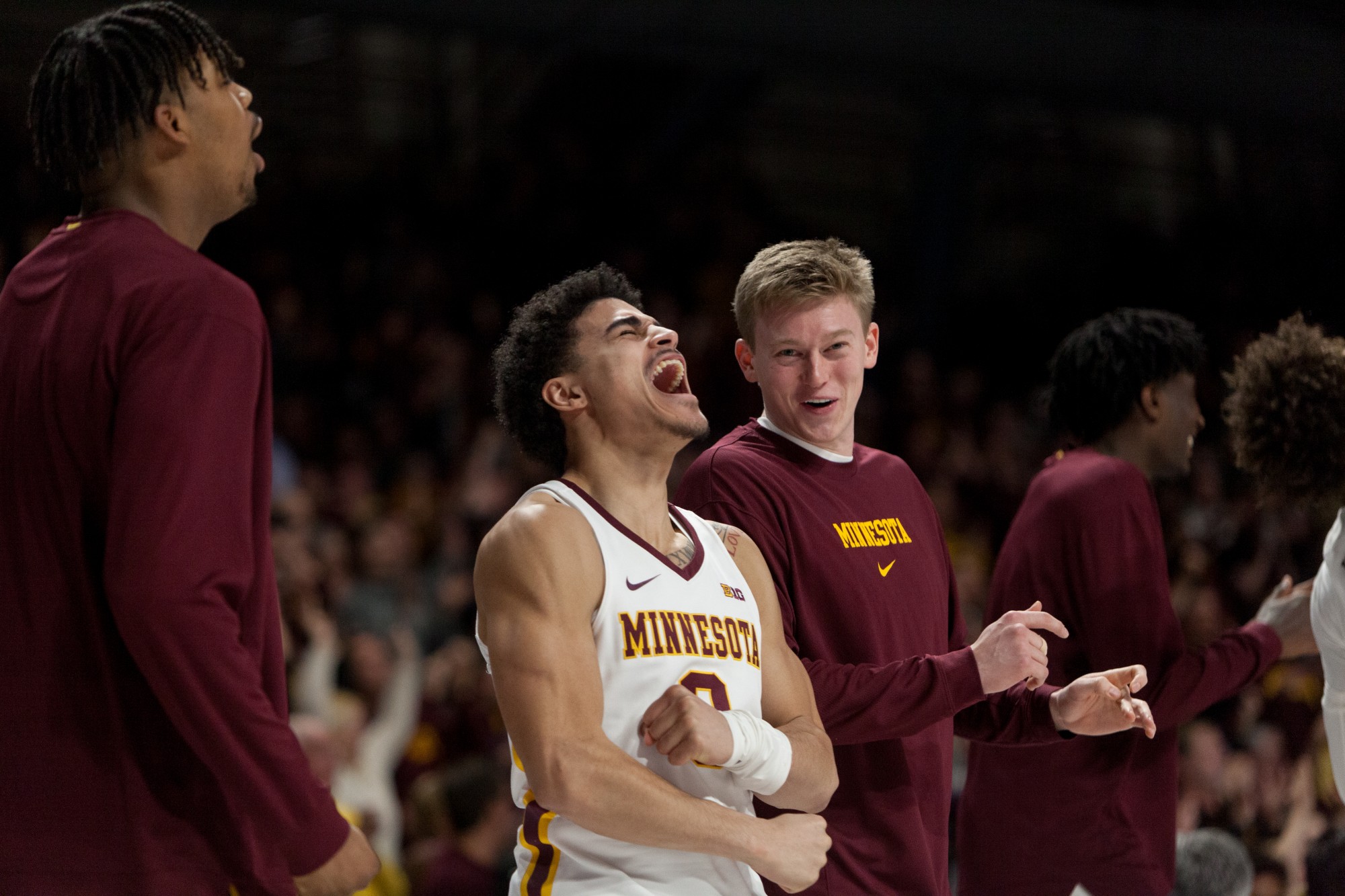 Gophers Guard Bryan Greenlee celebrates as a teammate scores at Williams Arena on Wednesday, Jan. 15.  Minnesota defeated the Penn State Nittany Lions 75-69. 