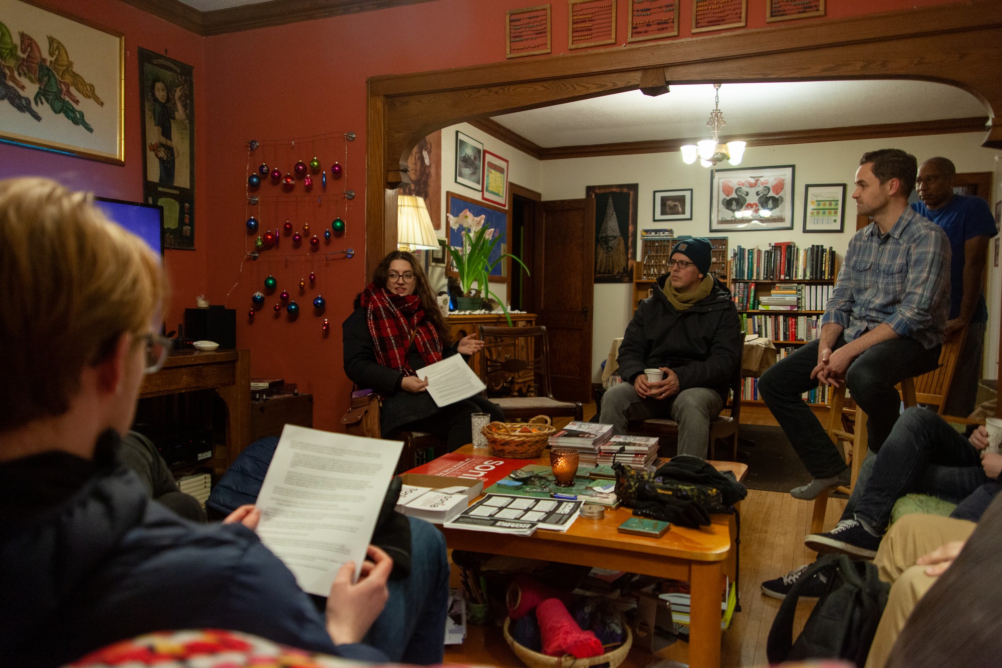 Sonia Neculescu strategizes with a small group of volunteers before a door-knocking session in Northeast Minneapolis on Thursday, Jan. 16. Neculescu is on the ballot for Minnesota House District 60A. (Kamaan Richards / Minnesota Daily)