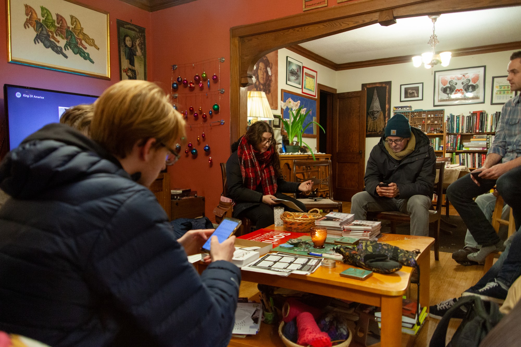 Sonia Neculescu strategizes with a small group of volunteers before a door-knocking session in Northeast Minneapolis on Thursday, Jan. 16. Neculescu is on the ballot for Minnesota House District 60A. (Kamaan Richards / Minnesota Daily)