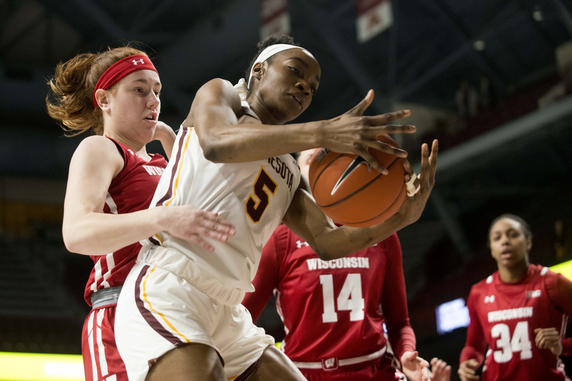 Forward Taiye Bello fights for the ball at Williams Arena on Wednesday, Jan. 22. The Gophers were defeated by Wisconsin 72-62. 