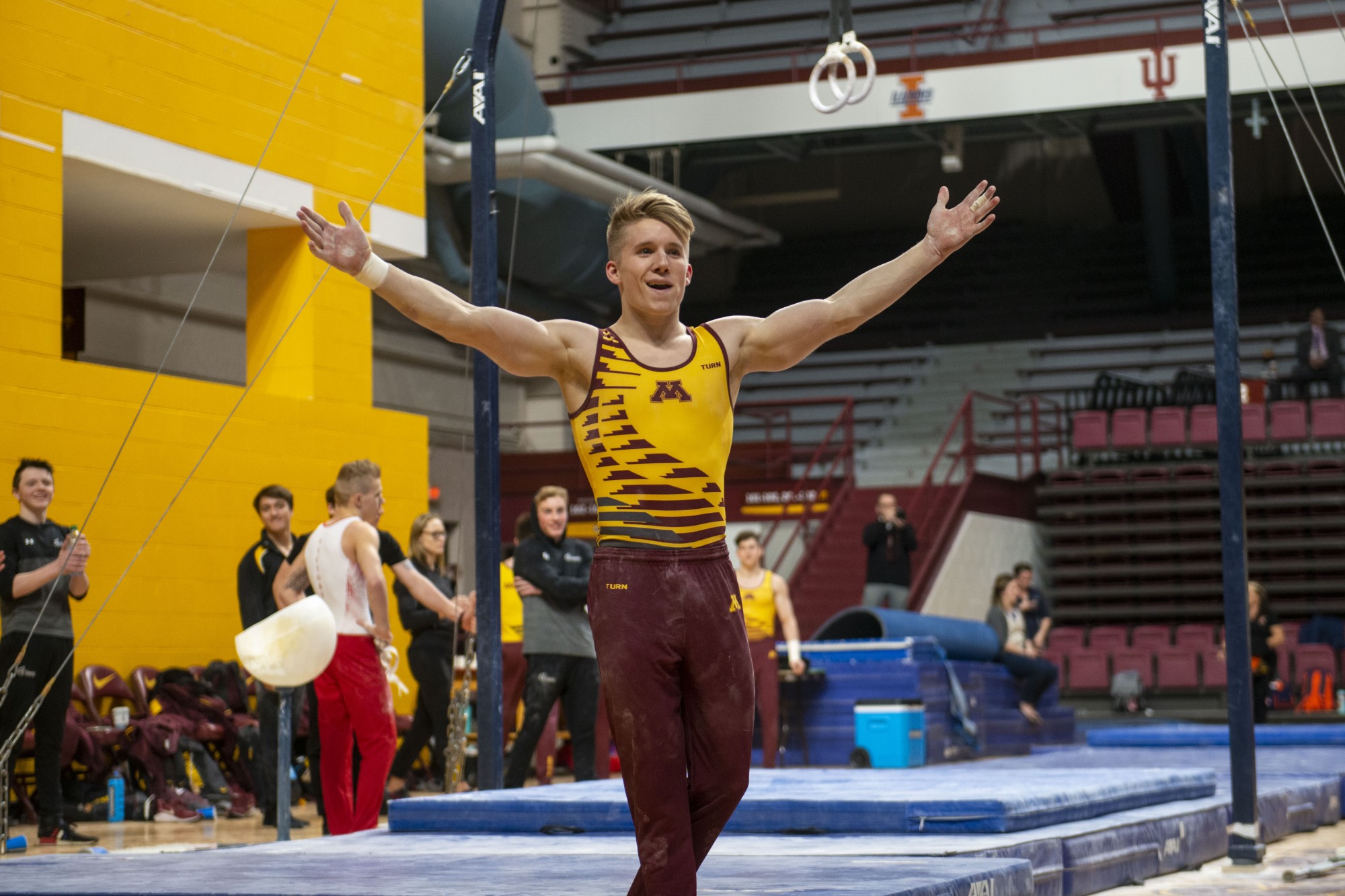 Junior Shane Wiskus performs celebrates with his teammates during the meet against against the Fighting Illini at the Maturi Pavilion on Friday, Jan. 24. 