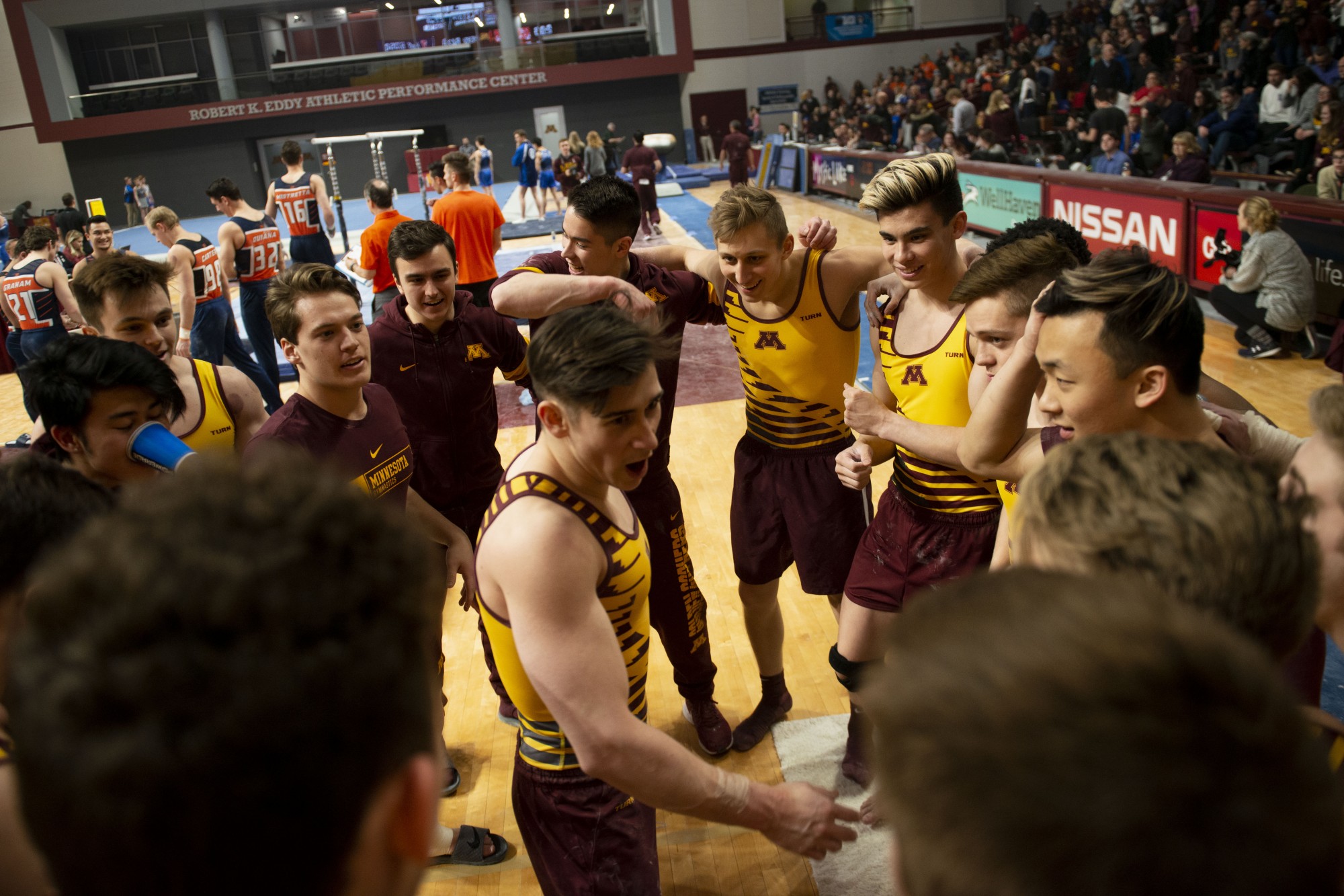 The Gophers huddle up during the meet against against the Fighting Illini at the Maturi Pavilion on Friday, Jan. 24. 