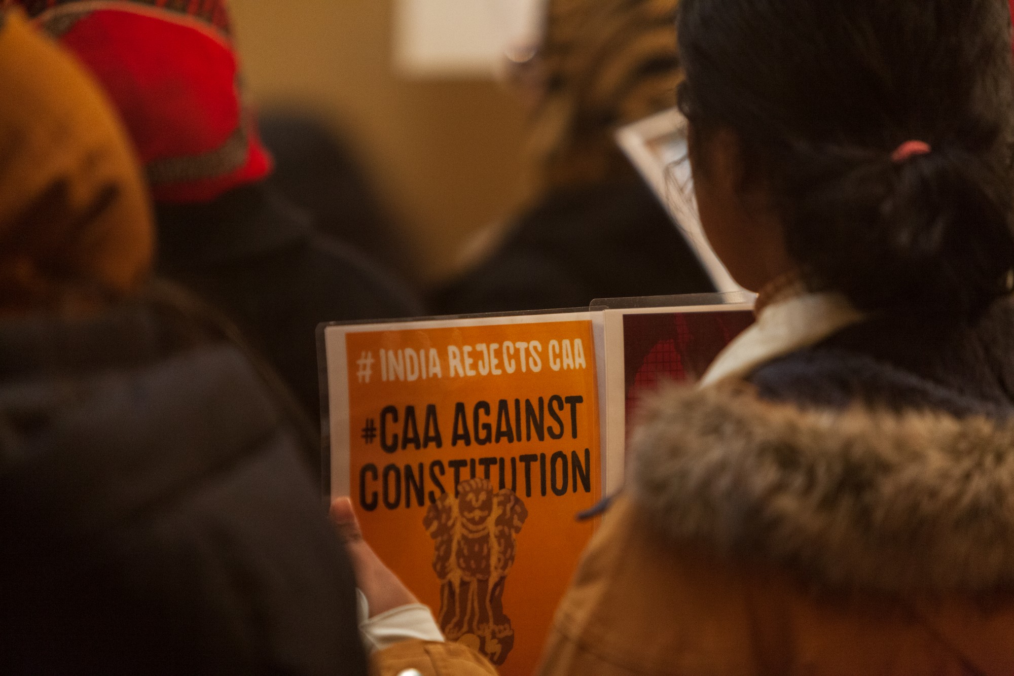 A young protestor holds a sign at an event opposing Indias recent passage of the Citizenship Amendment Act at the Minnesota State Capitol Building on Sunday, Jan. 26. This legislation offers Indian citizenship to refugees of several religious groups, but does not apply to Muslims, despite their making up nearly 15% of the Indian population.