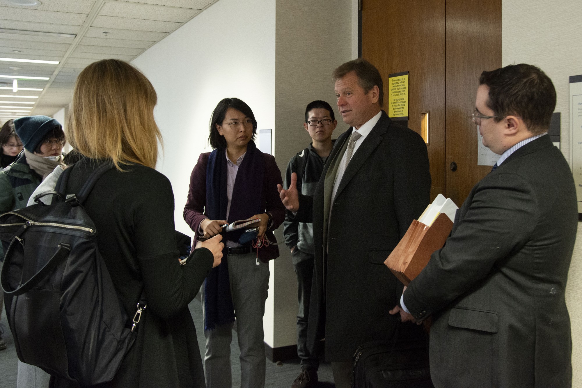 Prosecuting attorney Wil Florin speaks with supporters of Liu Jingyao after a hearing in the Hennepin County Courthouse on Tuesday, Jan. 28. The University of Minnesota student alleges she was raped by the Chinese billionaire Richard Liu in 2018. 