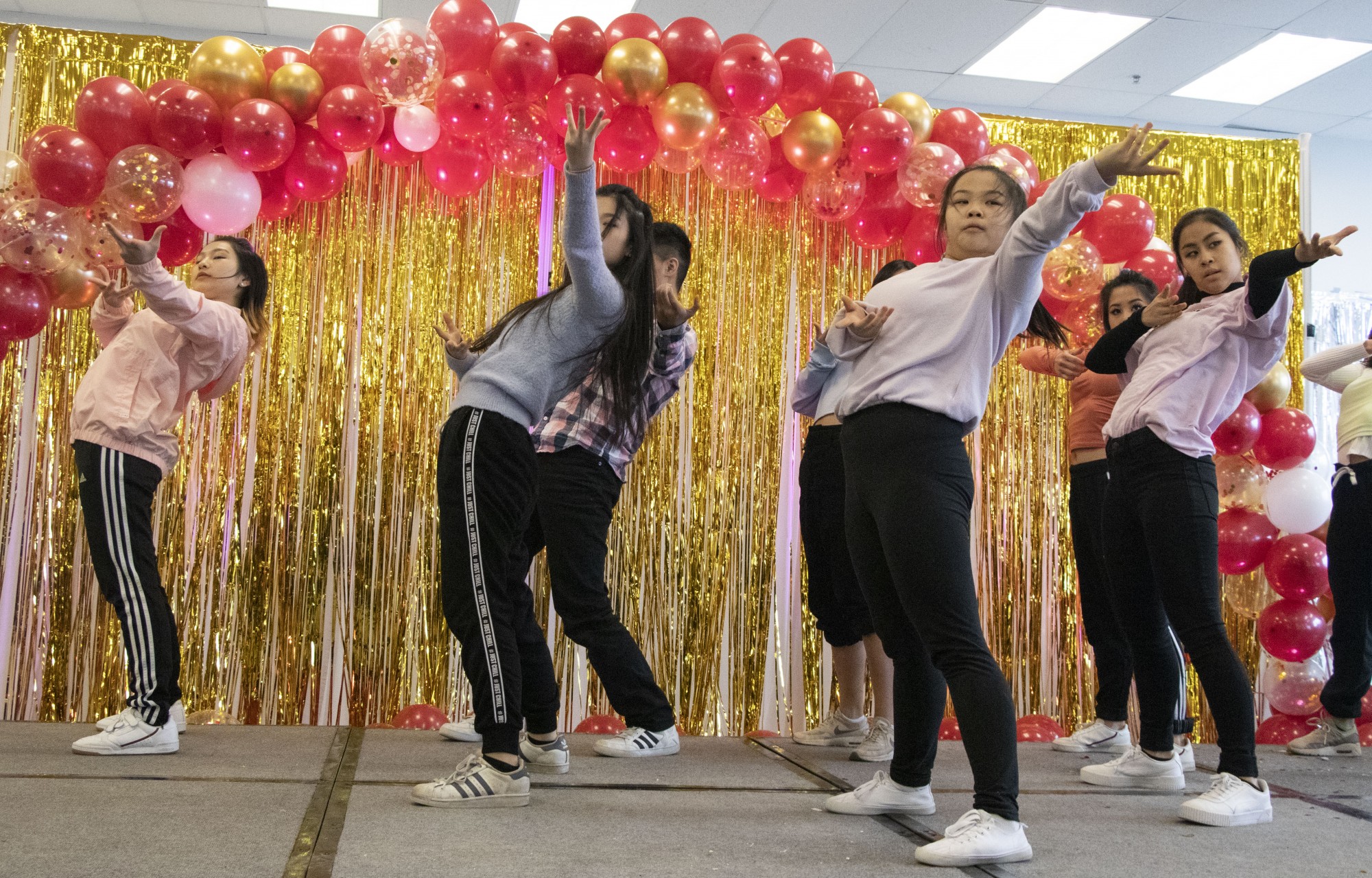 Cre.ture Crew members perform a Korean Hip-hop dance routine at the Lunar New Years celebration at the University Food Court on Sunday, Jan. 26.