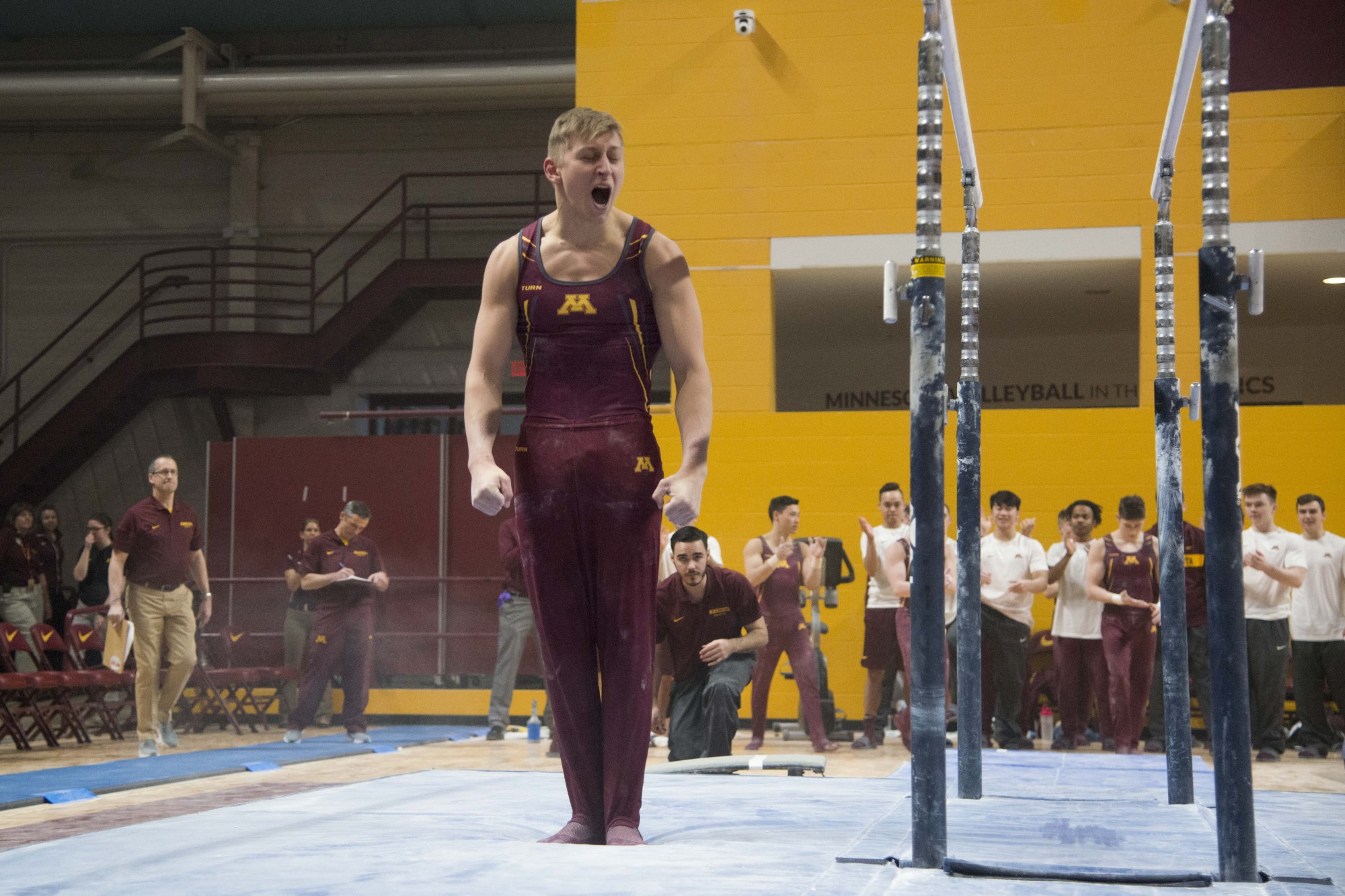 Senior Timmy Kutyla competes in the parallel bars at the Maturi Pavilion on Saturday, Jan. 26, 2019. 