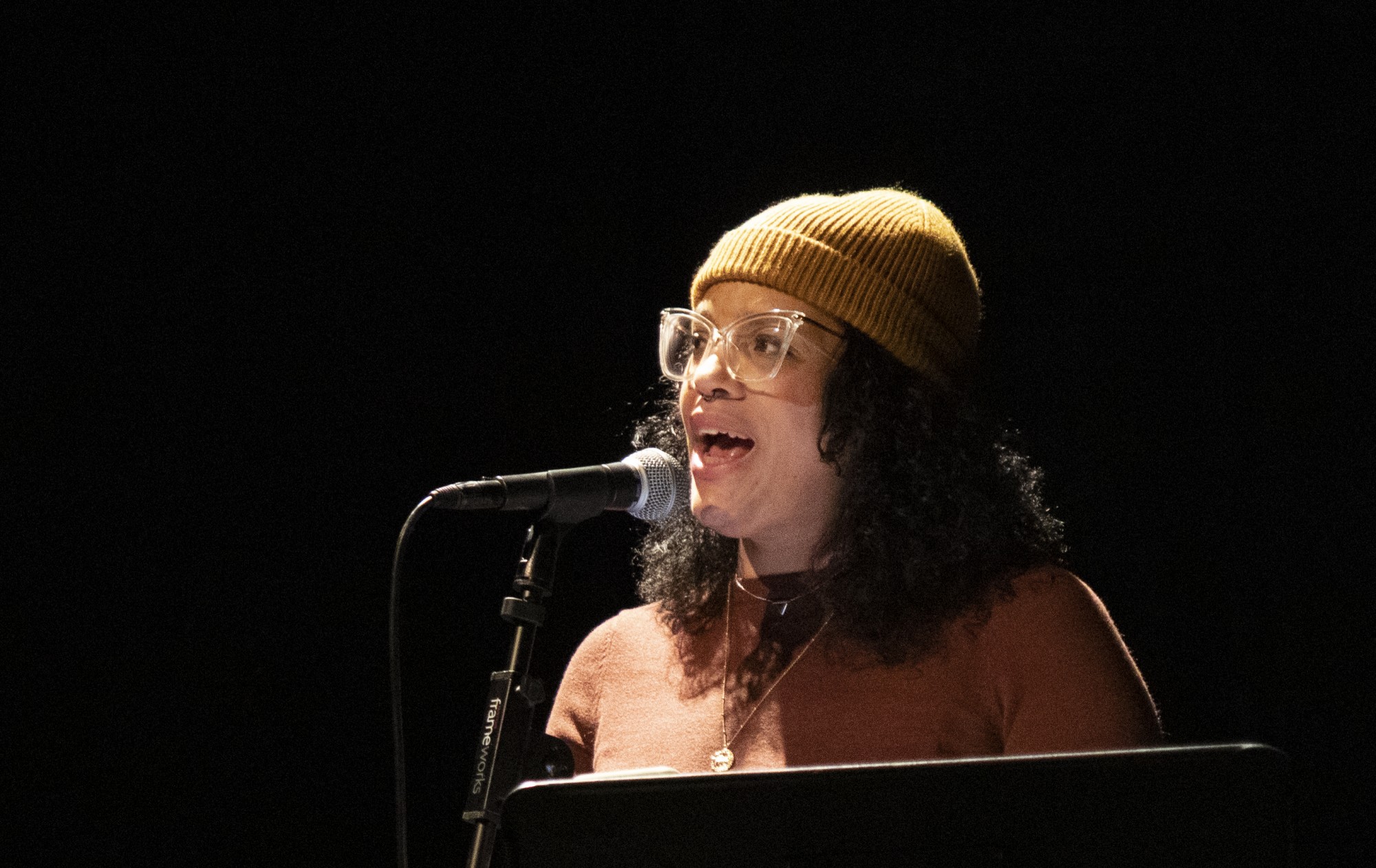Lisa Marie Brimmer performs original poetry in Work in  at The Southern Theater on Saturday, Feb. 8. The show highlighted local writers sharing their experiences with mental health and the creative process. 