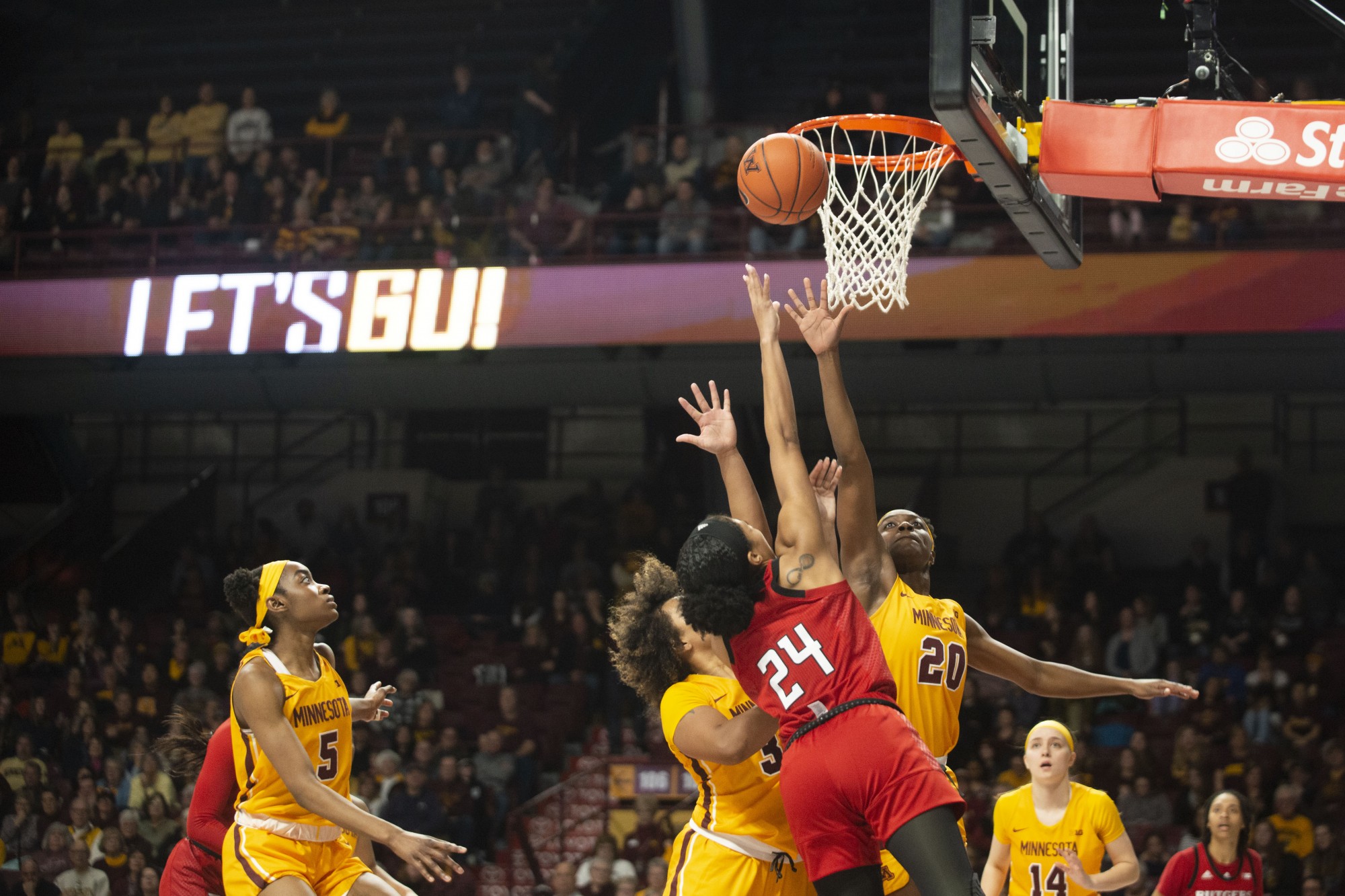 Guard Gadiva Hubbard and Forward Kehinde Bello jump for a rebound at Williams Arena on Sunday, Feb. 2. The Gophers won in overtime 73-71. 