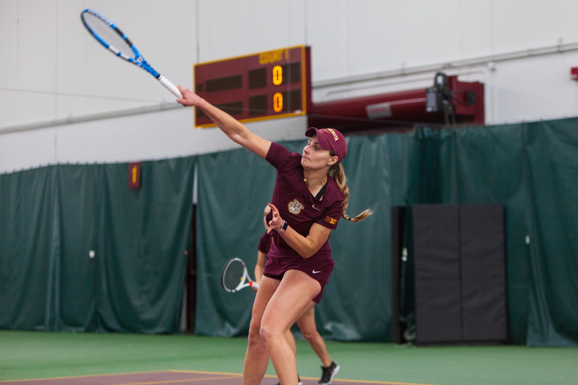 Gophers Senior Tiffany Huber returns a volley at the Baseline Tennis Center on Friday, Feb. 7.