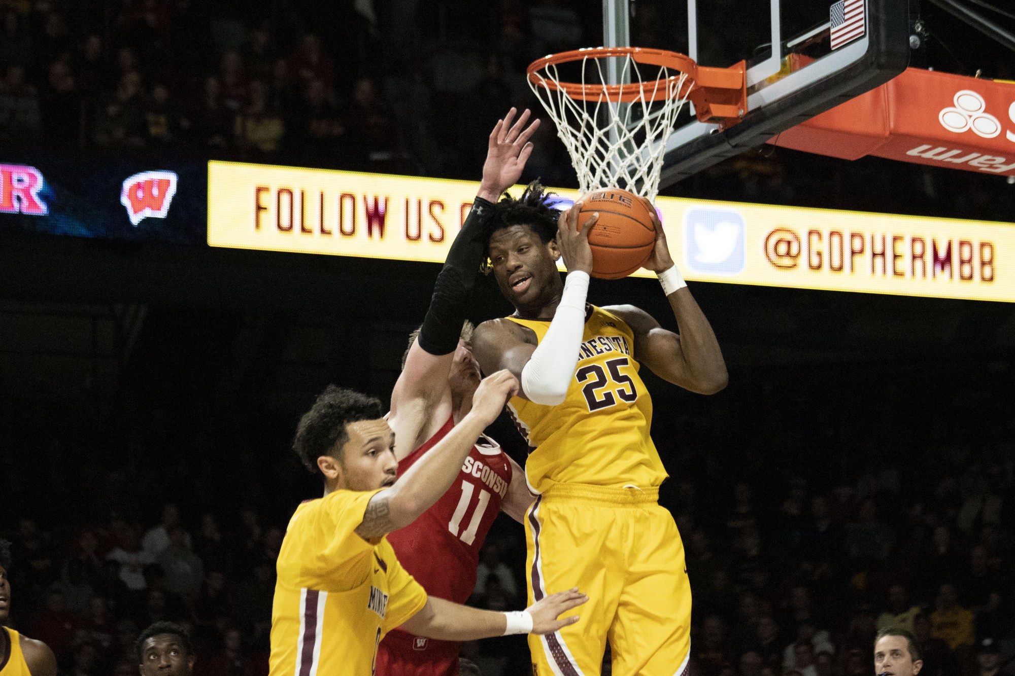 Center Daniel Oturu rebounds the ball at Williams Arena on Wednesday, Feb. 5. The Gophers beat the Badgers 70-52. 