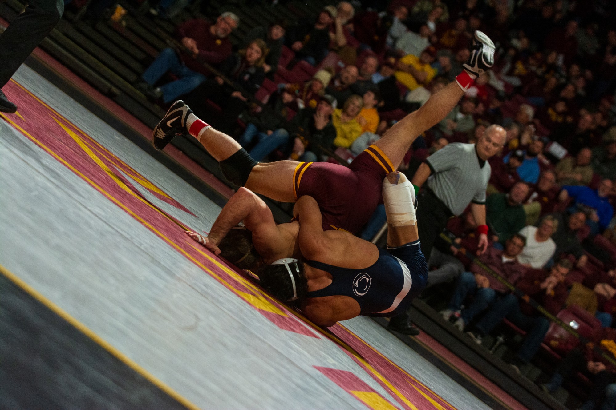 Gophers Redshirt Freshman Garrett Joles is thrown by his opponent at Maturi Pavilion on Sunday, Feb. 9. The Gophers lost to Penn State 31-10.
