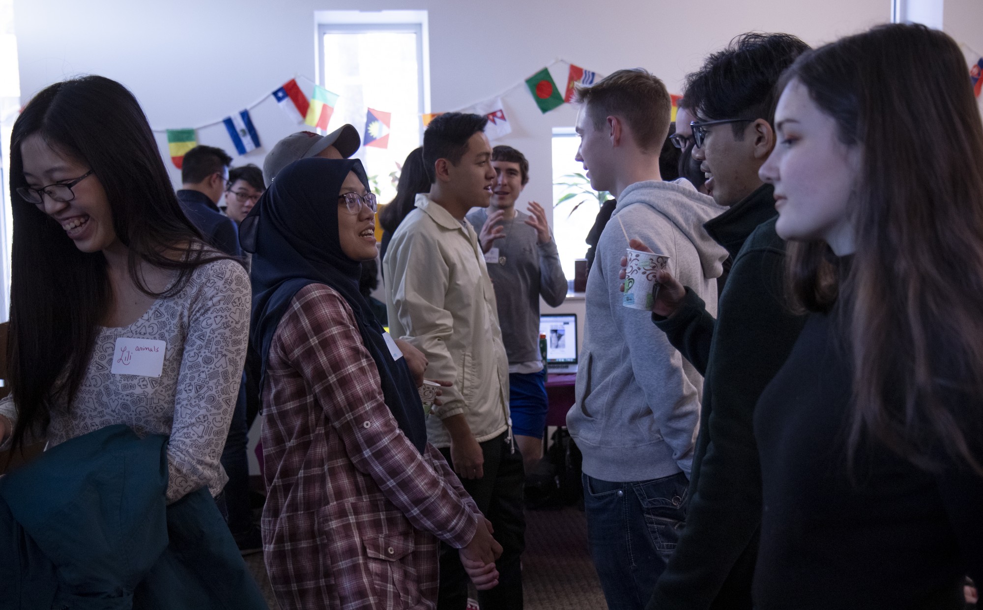Students mingle at Small World Coffee Hour’s Dating in Different Cultures event at the University International Center on Friday, Feb. 14. The event included presentations about love and dating, world cultures and opportunities for attendees to win prizes and build community.