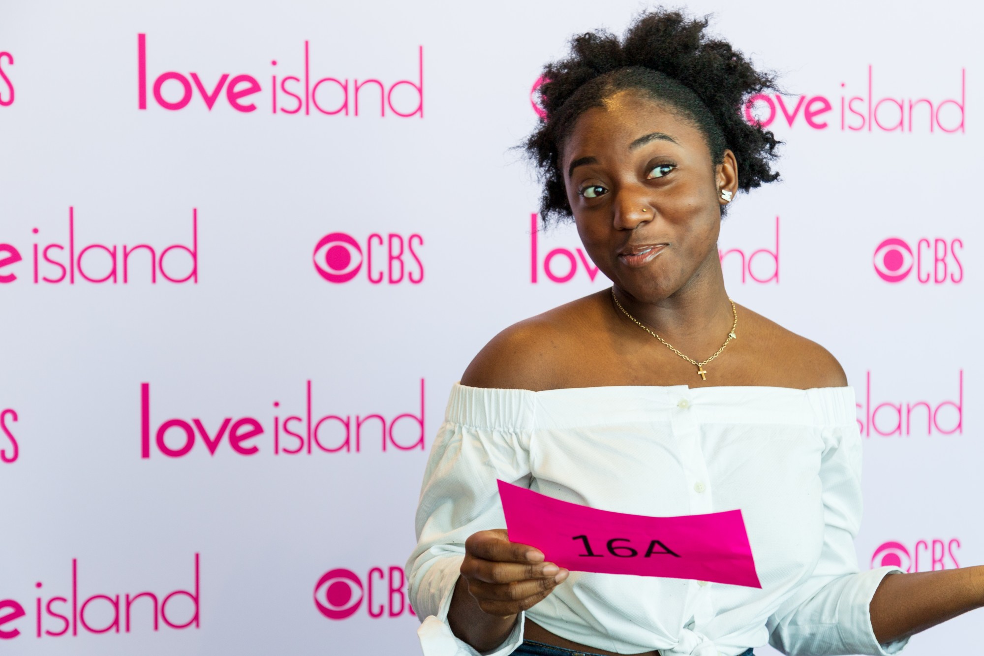 Auditionee Mimi Ewuakye poses with her call number at an open casting for ‘Love Island at Surly Brewing Company on Saturday, Feb. 15.