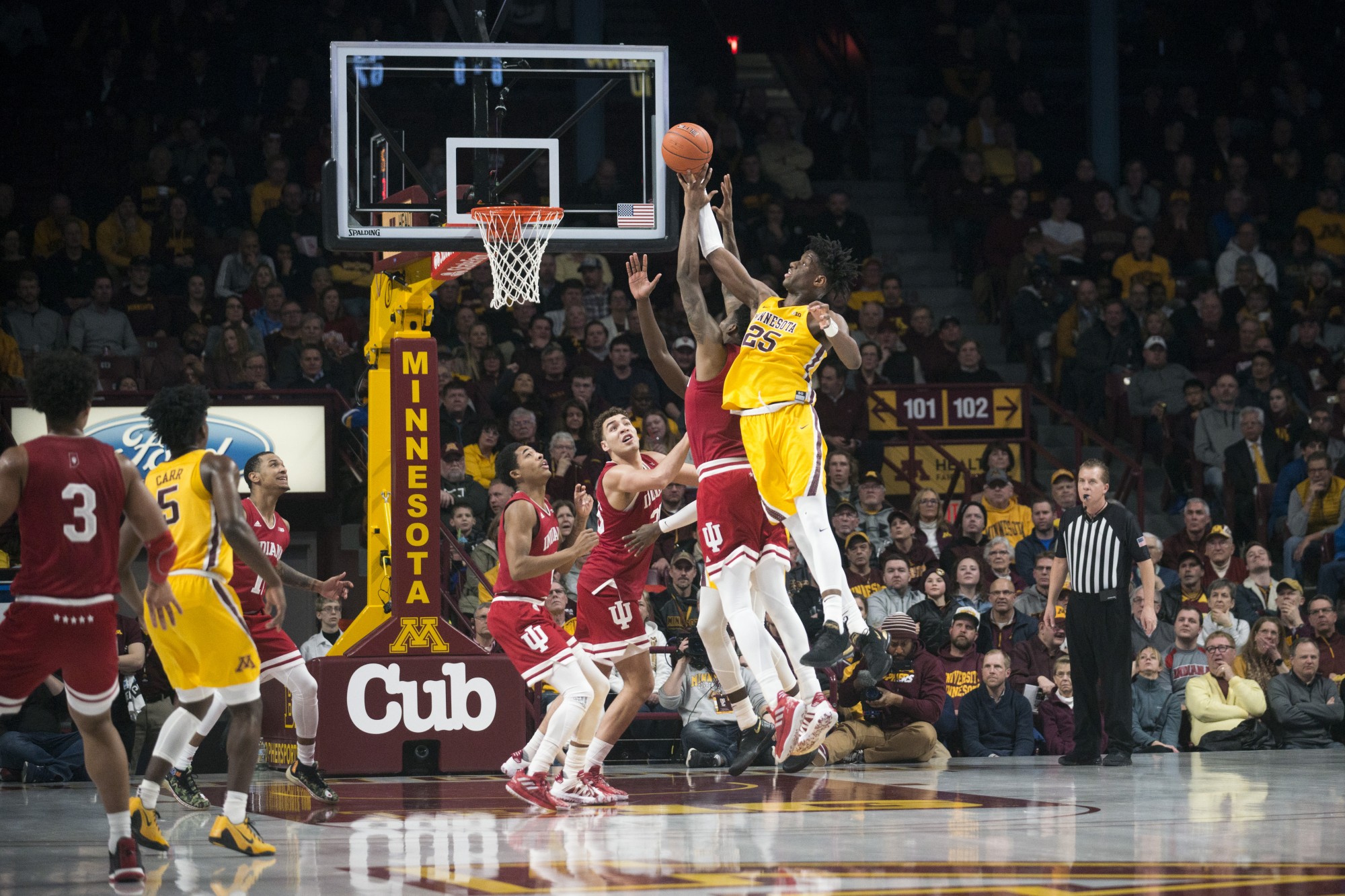Center Daniel Oturu jumps for a rebound at Williams Arena on Wednesday, Feb. 19. The Gophers fell to Indiana 68-56. 