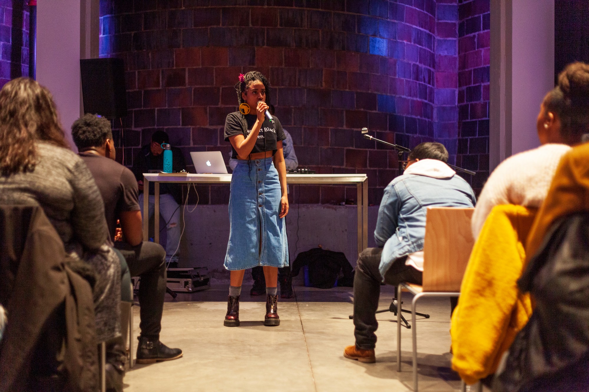 Co-organizer Ricki Williams addresses the audience at the Tangible Thoughts Open Mic event at A-Mill Artist Lofts on Saturday, Feb. 15. The recurring event serves as a platform to highlight black thought and expression in the Twin Cities.