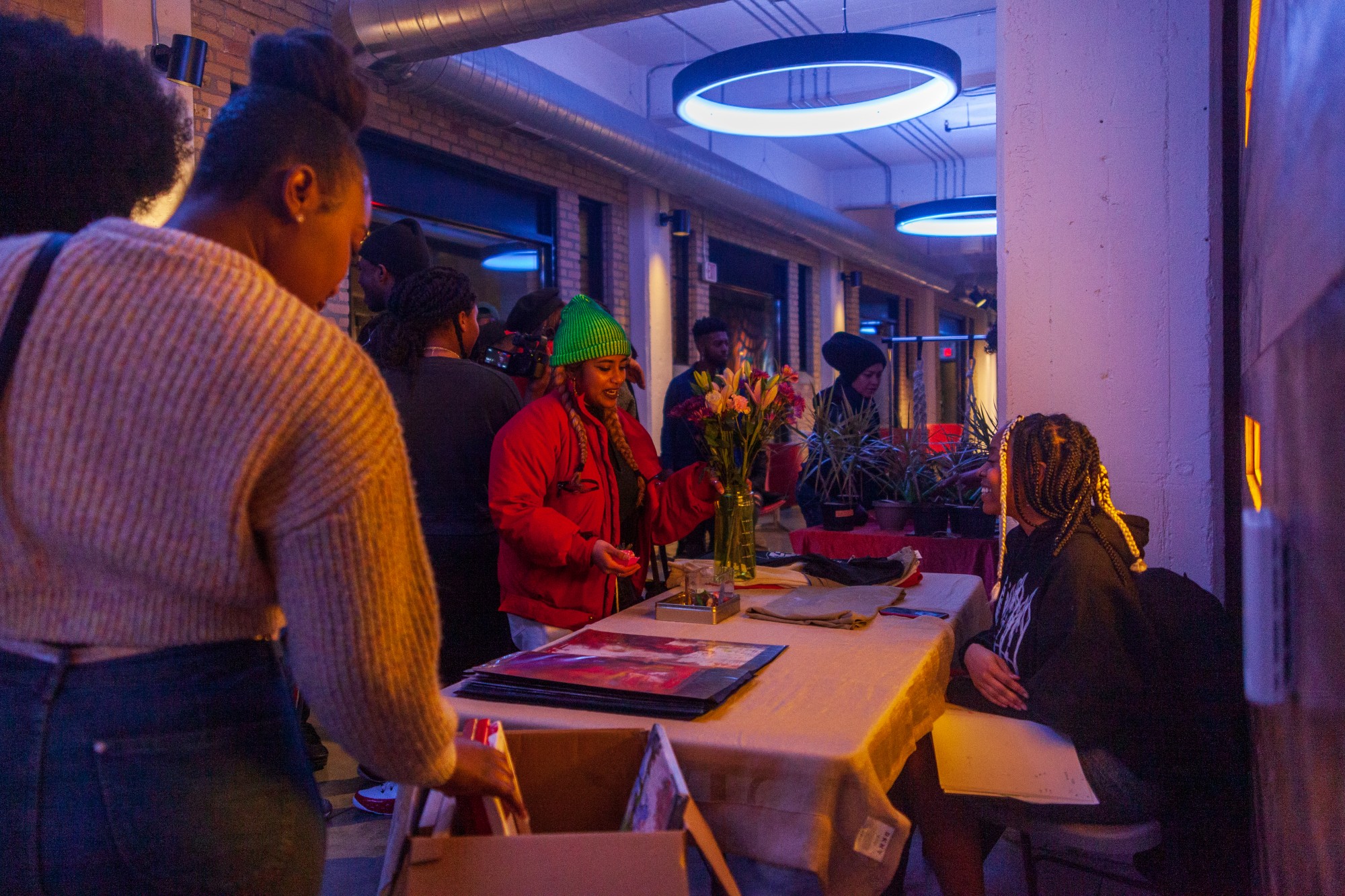 Attendees mingle with the artists and vendors at the Tangible Thoughts Open Mic event at A-Mill Artist Lofts on Saturday, Feb. 15. The recurring event serves as a platform to highlight Black thought and expression in the Twin Cities.