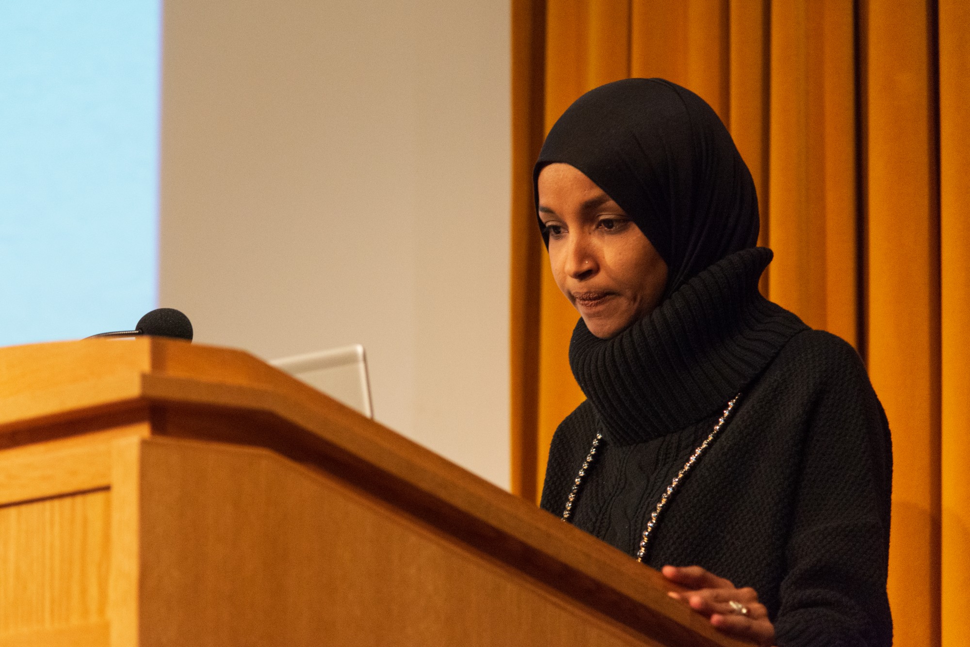 Rep. Ilhan Omar addresses an audience in Cowles Auditorium on Tuesday, Feb. 18. The event centered around her “Pathway to Peace”, a package of seven bills which aim to reorient U.S. foreign policy.