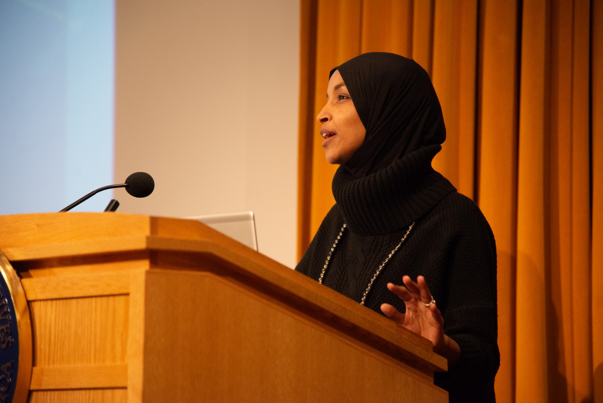 Rep. Ilhan Omar addresses an audience in Cowles Auditorium on Tuesday, Feb. 18. The event centered around her “Pathway to Peace”, a package of seven bills which aim to reorient U.S. foreign policy.