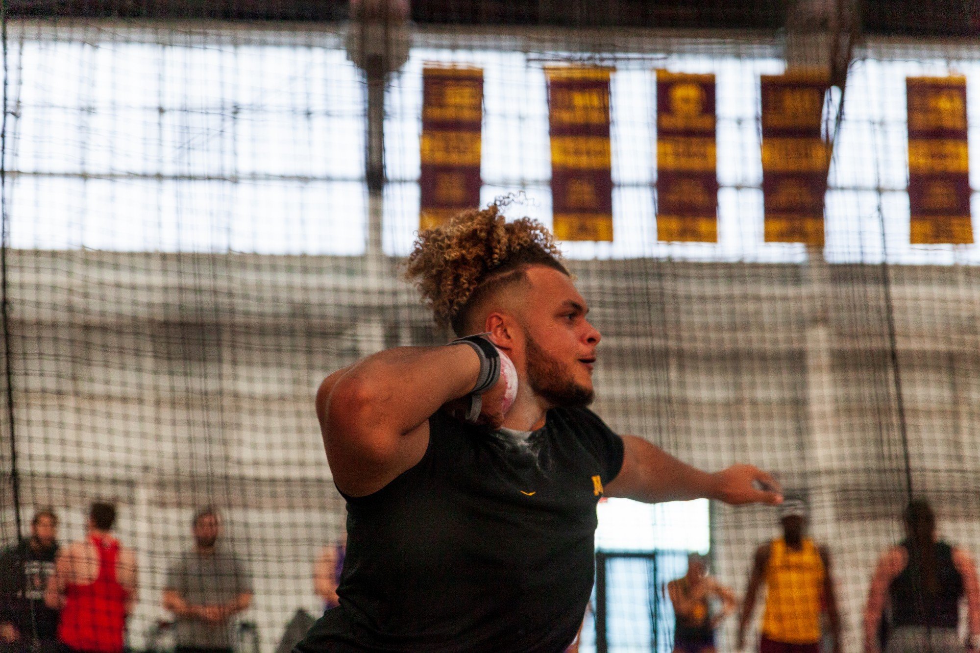 Gophers Freshman Kyle Atkinson competes unattached in the shot put at the Minnesota Cold Classic at the University of Minnesota Fieldhouse on Friday, Feb. 21.