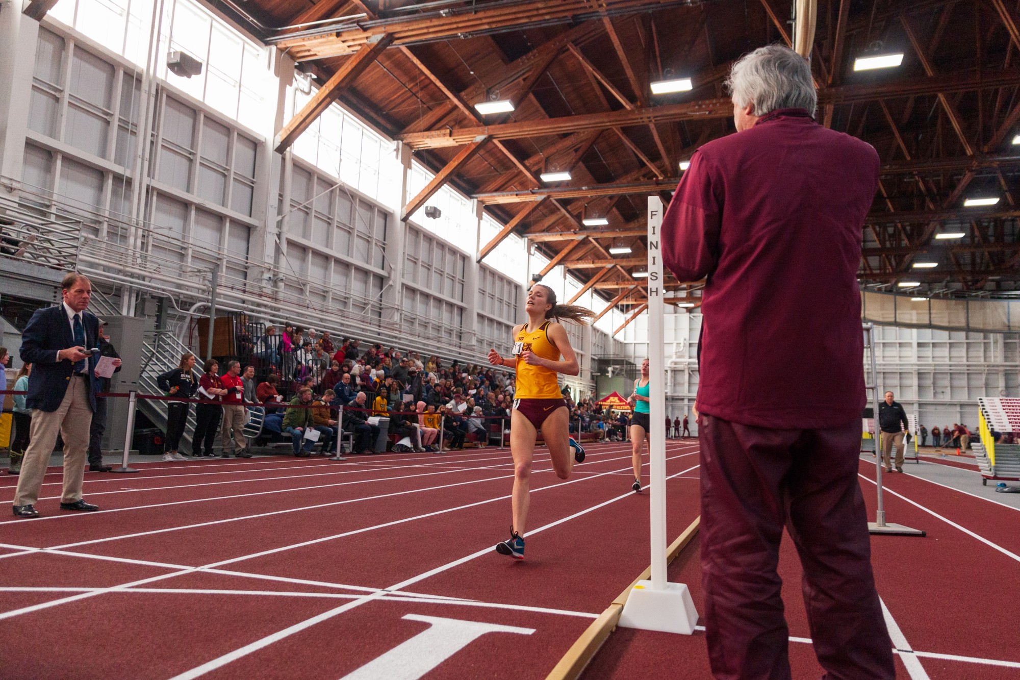 Gophers Redshirt Freshman Taylor Krone crosses the finish line of the mile run at the Minnesota Cold Classic at the University of Minnesota Fieldhouse on Friday, Feb. 21.