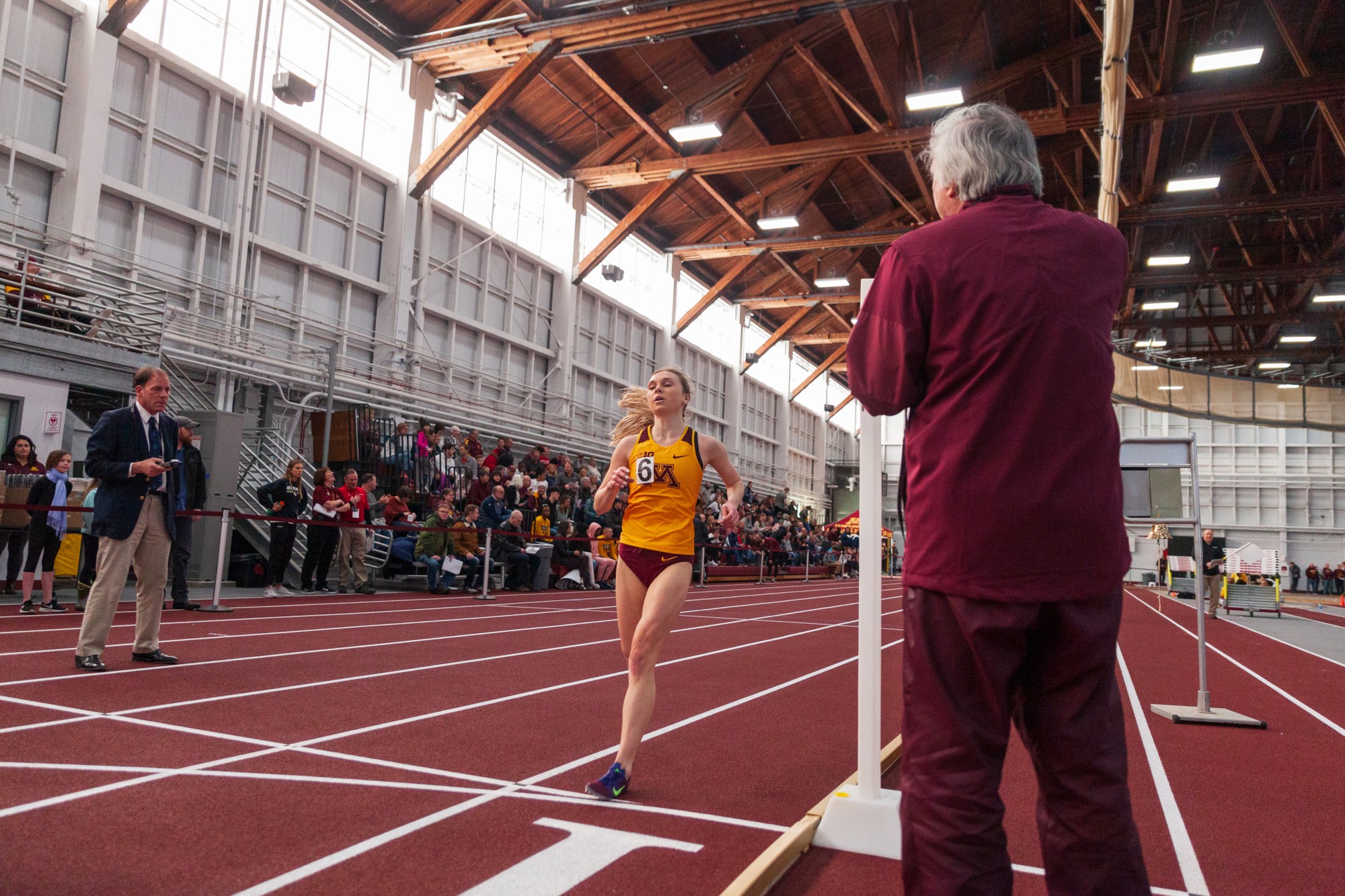 Gophers Redshirt Junior Kayla Baker crosses the finish line of the mile run at the Minnesota Cold Classic at the University of Minnesota Fieldhouse on Friday, Feb. 21.
