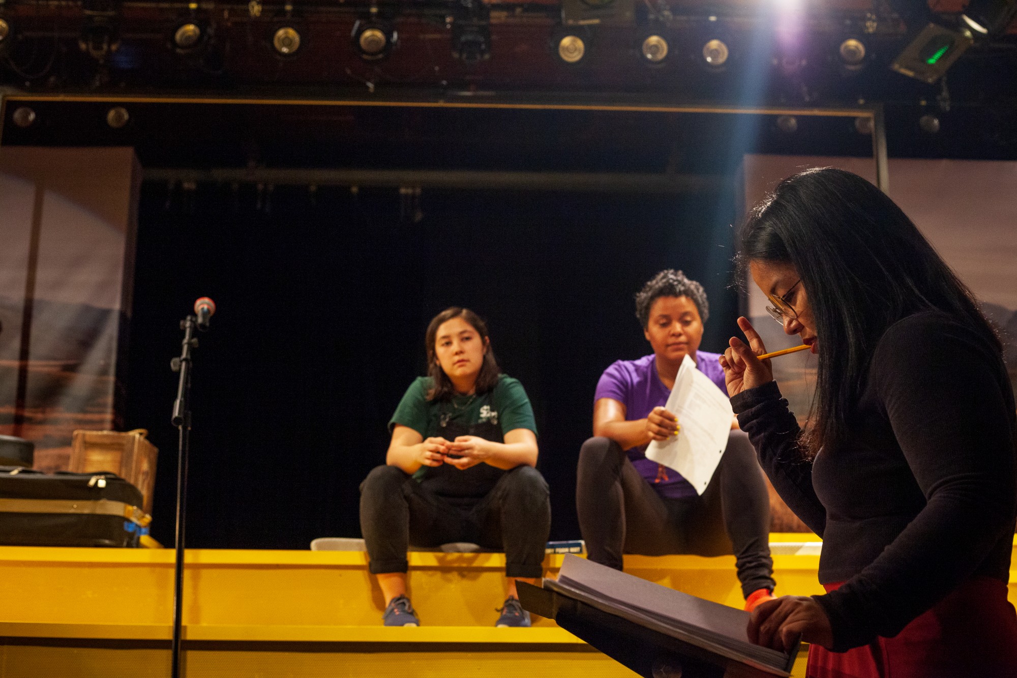 Director Jesca Prudencio directs members of the cast during a rehearsal of Interstate at MixedBlood Theatre on Tuesday, Feb. 18. The production, created by Kit Yan and Melissa Li, follows the experiences of two trans people, navigating a myriad of cultural issues.