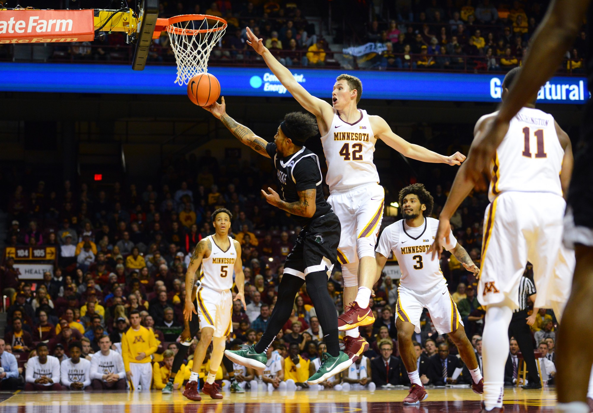 Forward Michael Hurt attempts to block a shot by SC Upstate at Williams Arena on Friday, Nov. 10. 