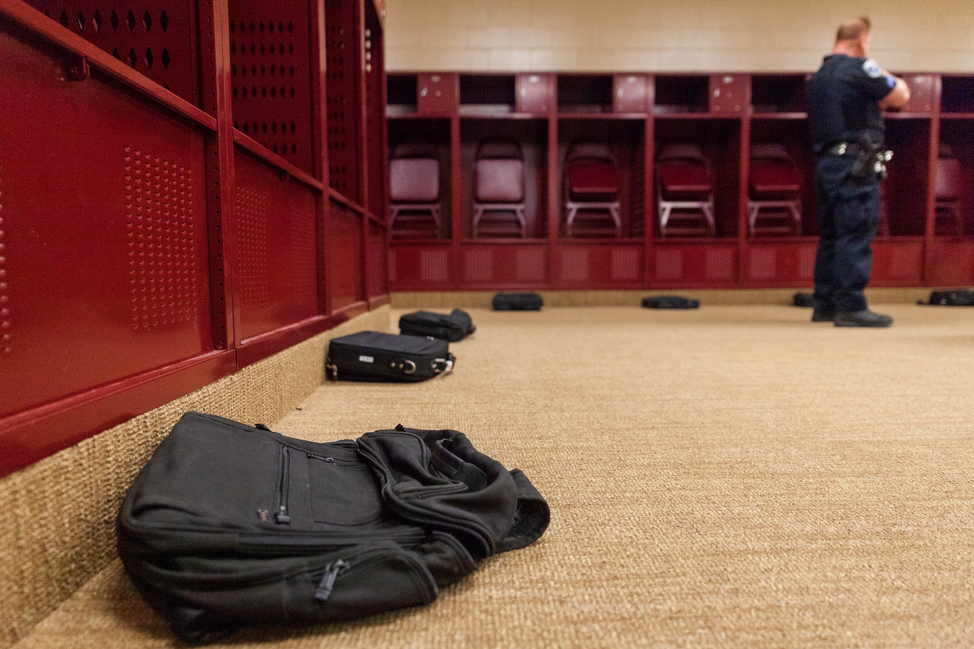 Various bags are placed around the perimeter of the room ahead of a demonstration of explosives detection dogs at TCF Bank Stadium on Tuesday, Feb. 25. One of the bags has been scented with explosives for the dog to identify.
