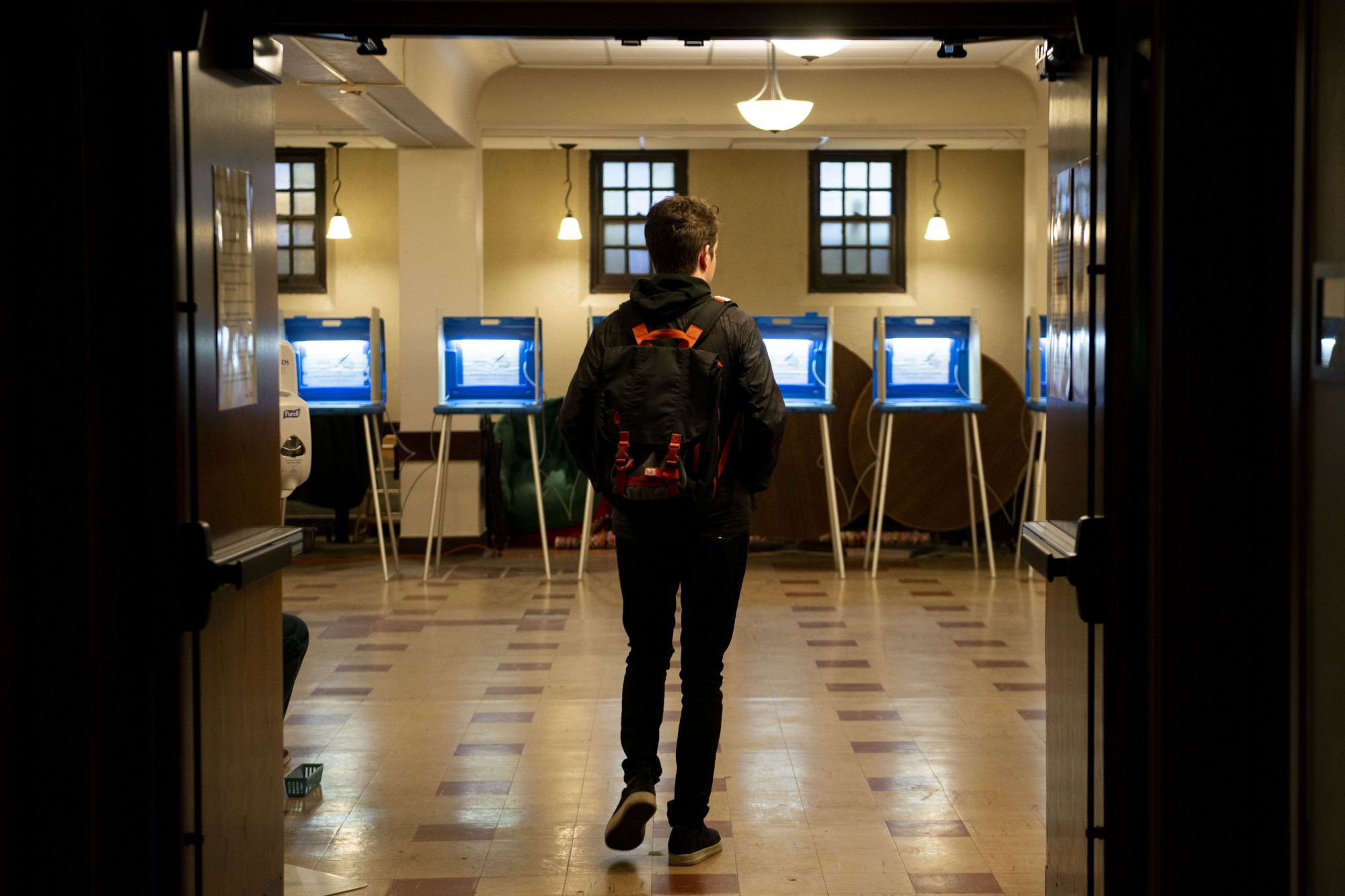 A voter enters the polling place at the Grace University Lutheran Church early in the morning on Tuesday, March 3. 