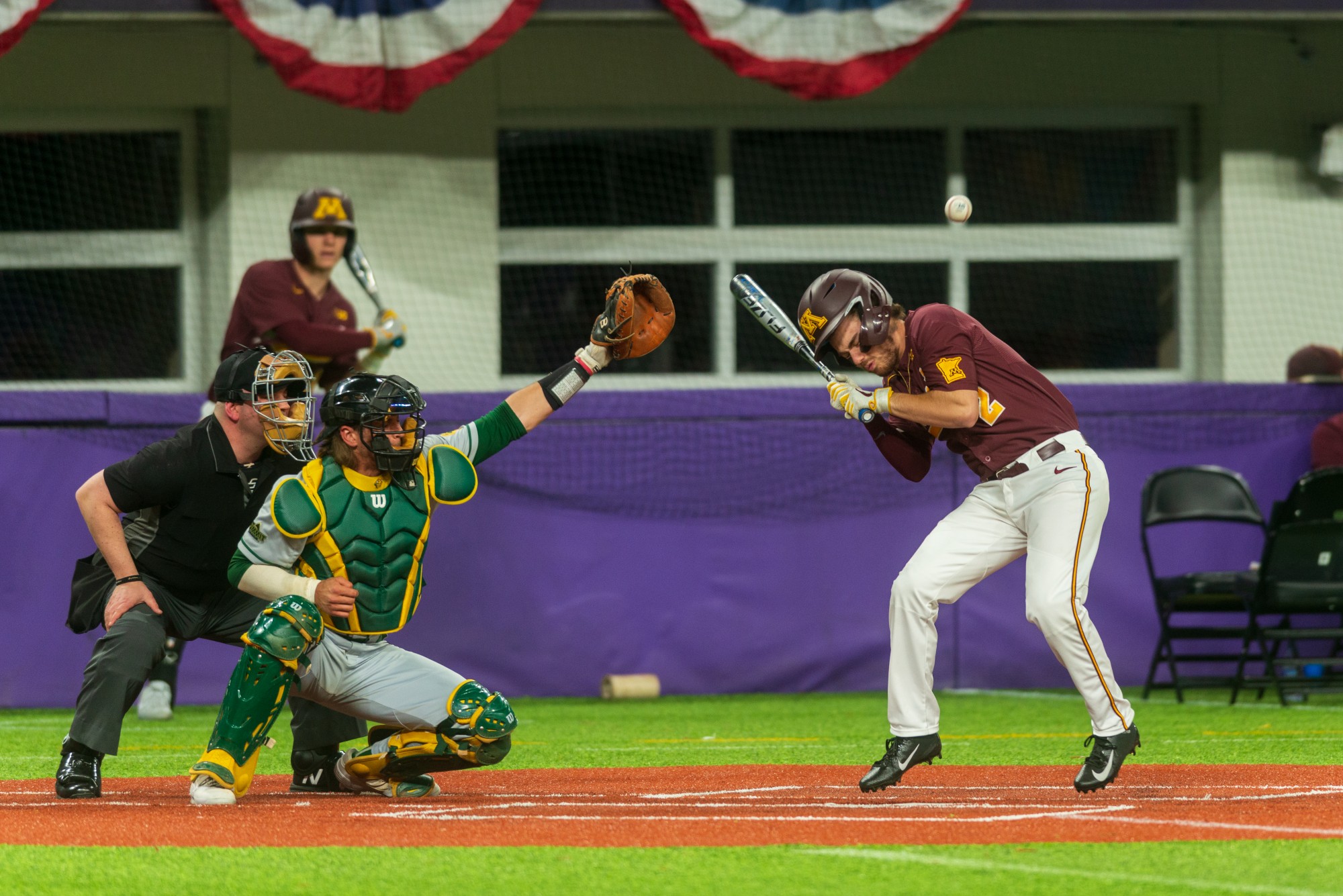 Gophers Infielder Zack Raabe is struck by a pitch at U.S. Bank Stadium on Tuesday, March 3.