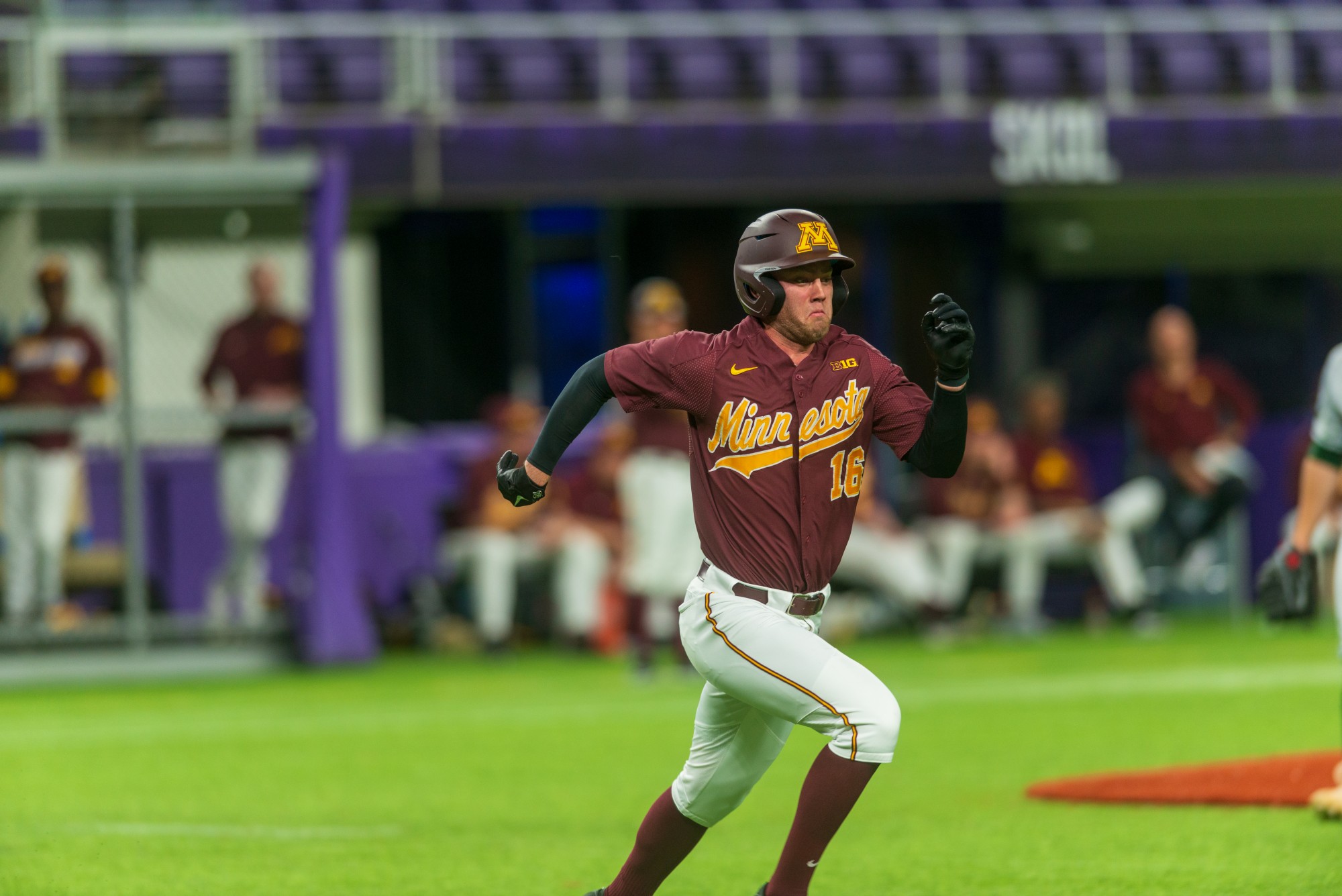 Gophers Outfielder Easton Bertrand sprints for first base after a hit at U.S. Bank Stadium on Tuesday, March 3.