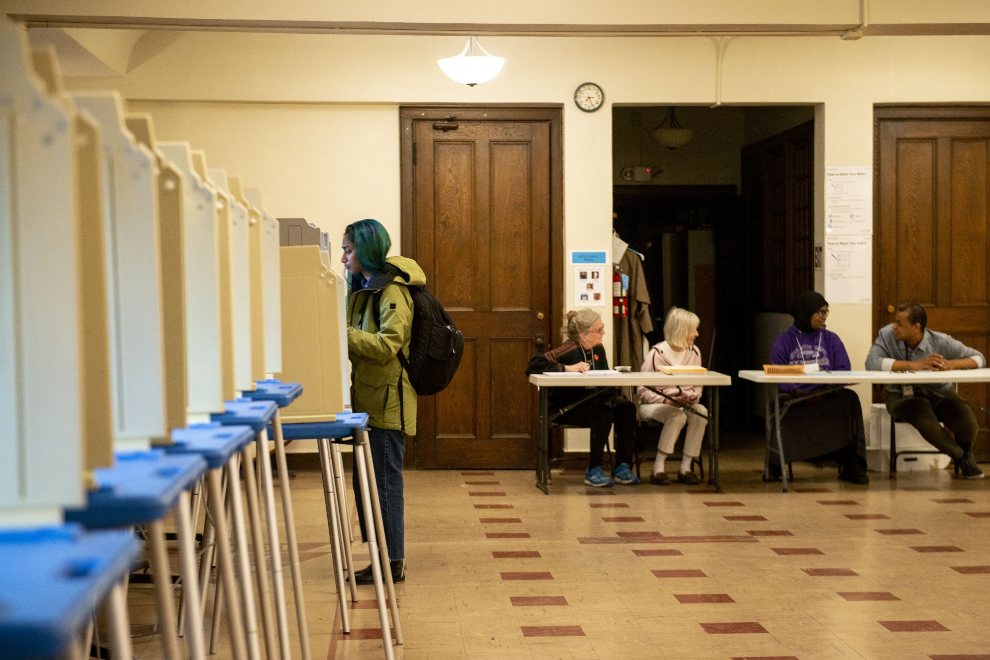 A voter casts her ballot at the Grace University Lutheran Church on Tuesday, March 3, 2020.