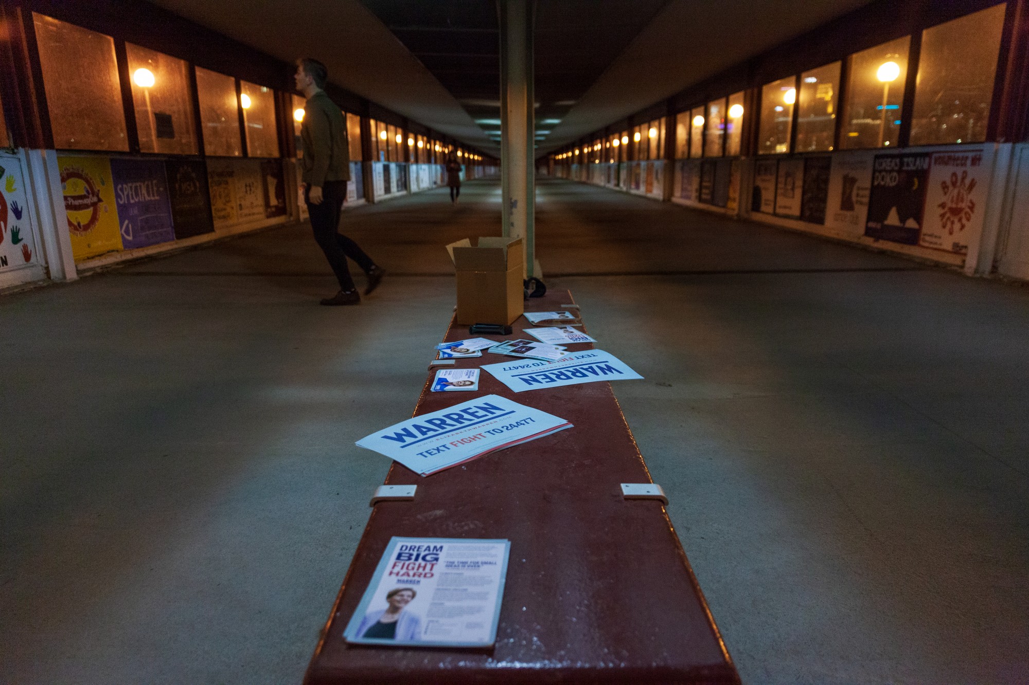Posters and flyers for Democratic Presidential Candidate Sen. Elizabeth Warren litter a bench on the East Bank on Monday, March 2.