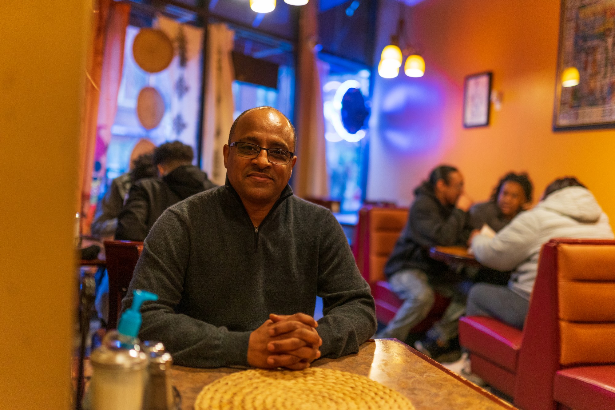 Restaurant Owner Russom Solomon poses for a portrait inside his business, Red Sea, on Friday, Feb. 28. Solomon is vocal in his opposition to the new community center development across the street, citing the developers failure to properly engage with the community.