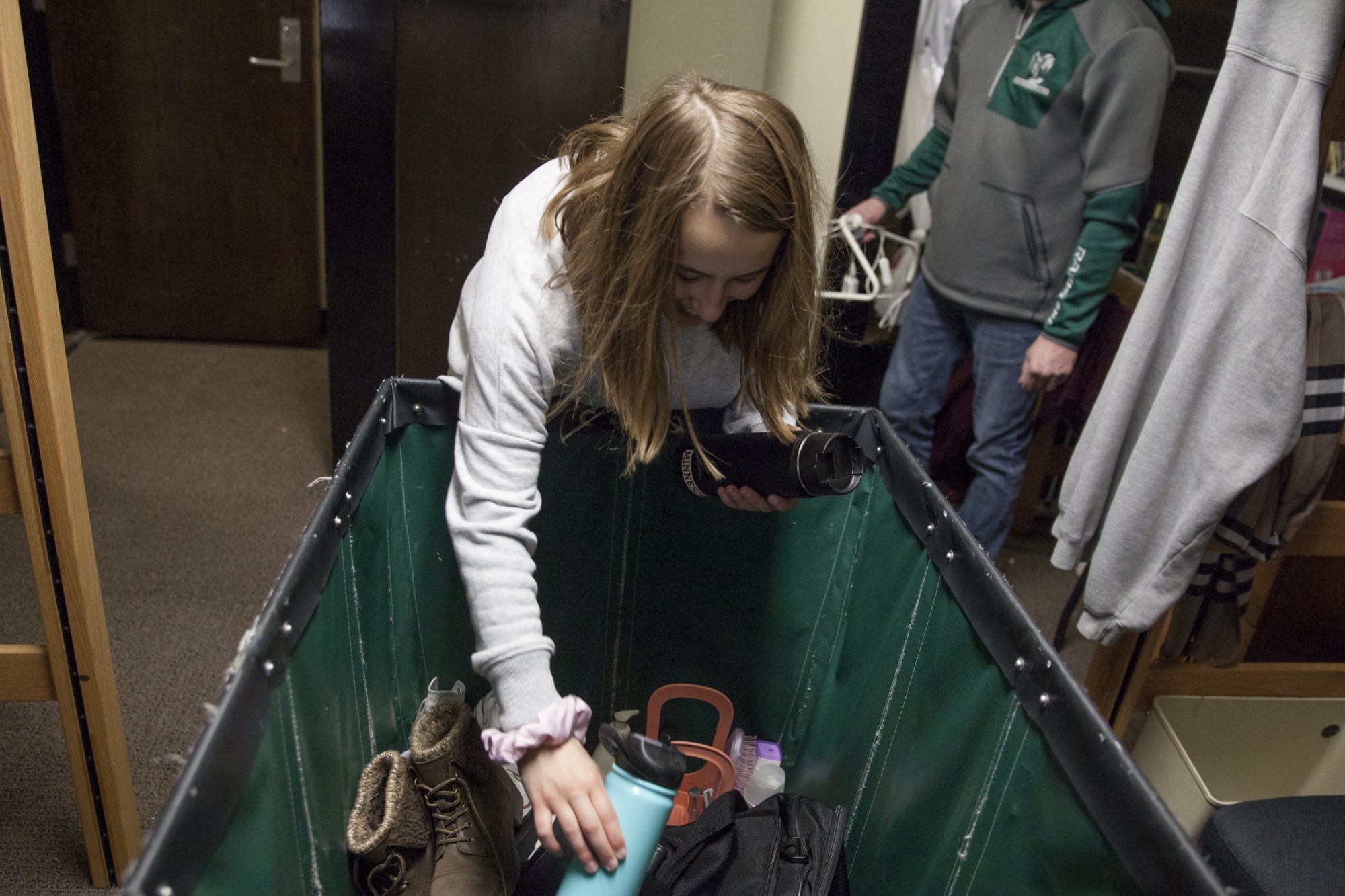 Freshman Marissa Mazzetta packs up her dorm room in preparation for her return to Illinois with her father, Jim Mazzetta, at Middlebrook Hall on Saturday, March 21. Mazzetta, like many freshmen at the University of Minnesota, is moving out of University Housing as a result of COVID-19, otherwise known as the Coronavirus.