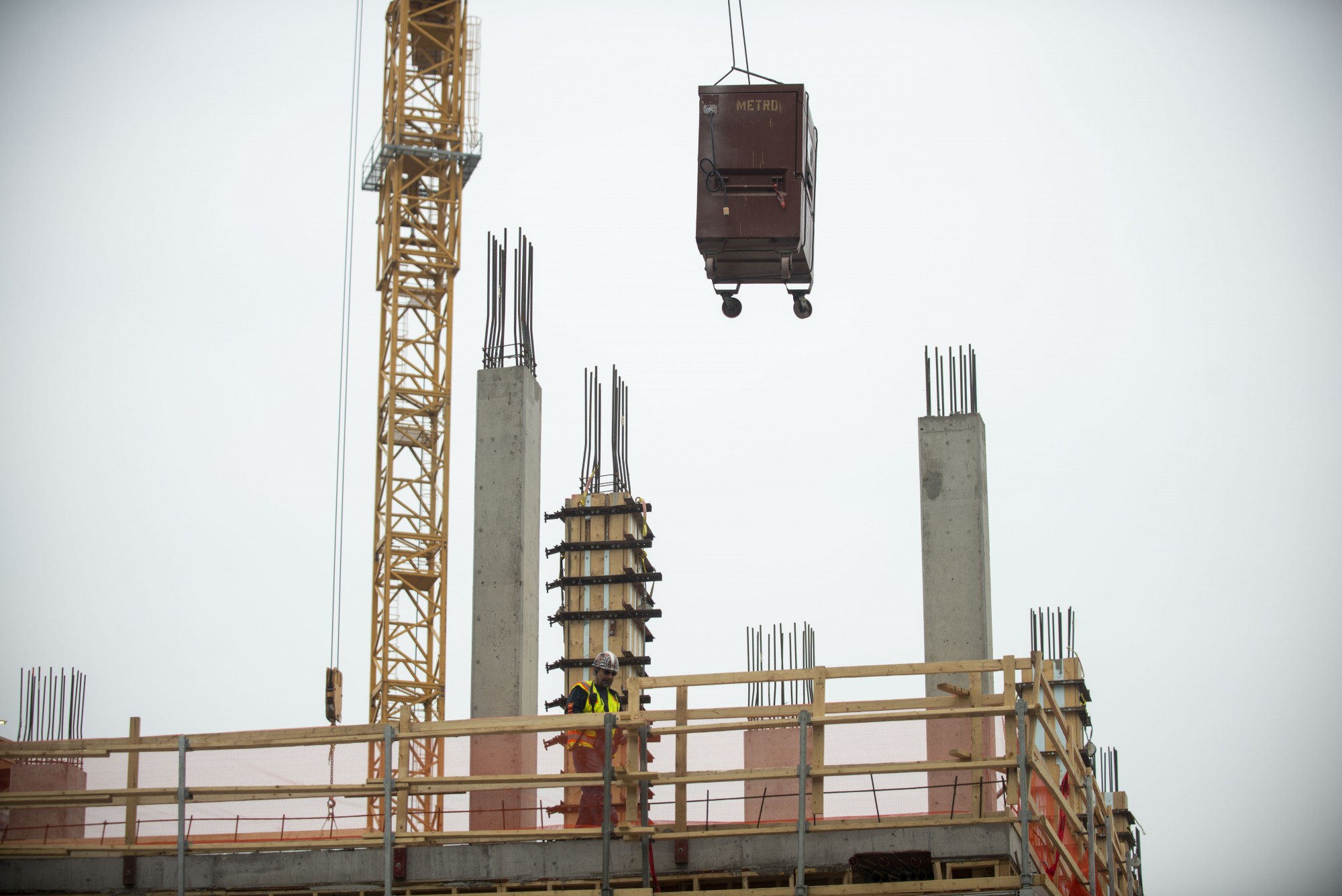 Construction is conducted in Minneapolis on Monday, April 6. Many developments could be put on hold as policymakers try to decrease COVID-19’s spread.