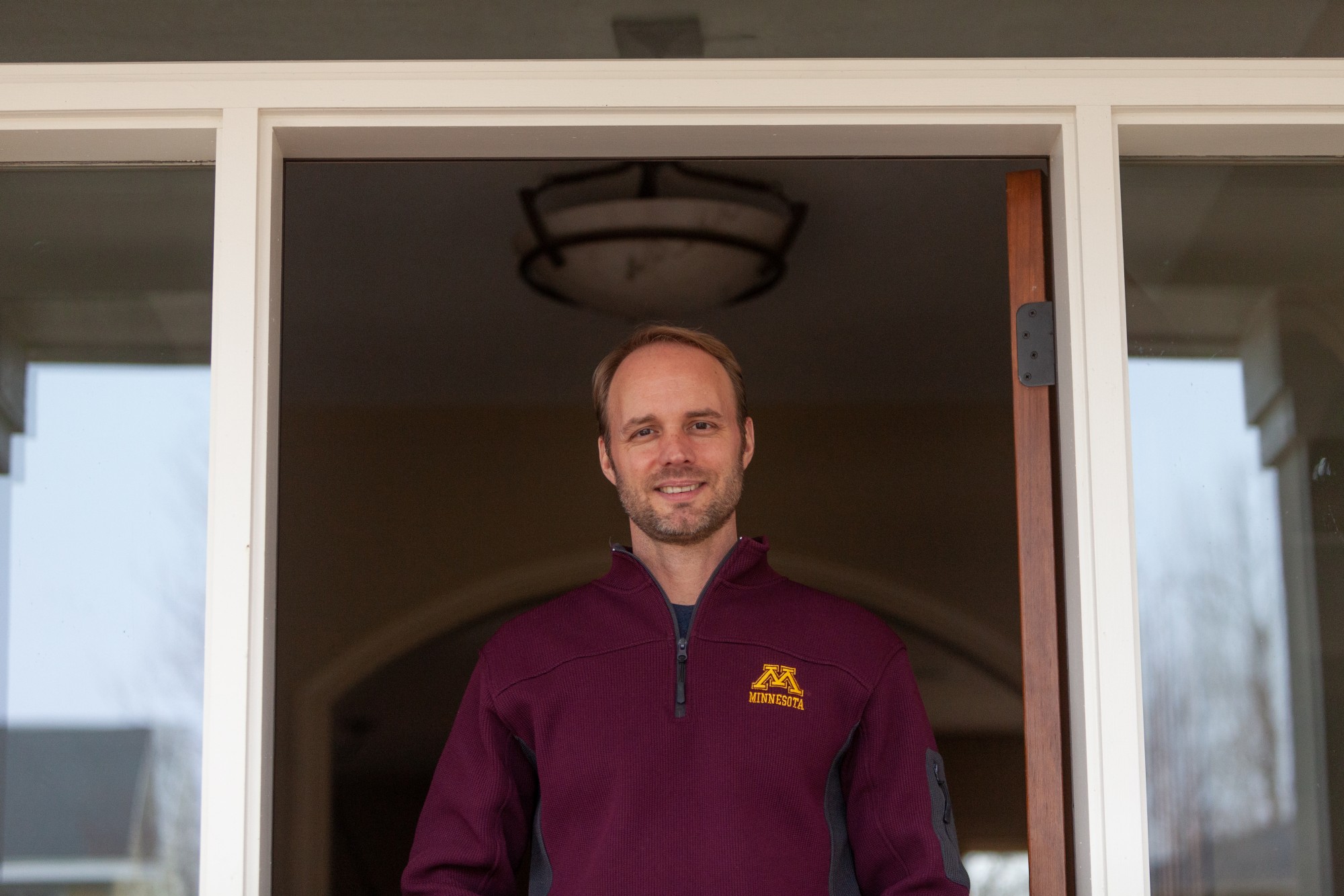 Associate Professor of Epidemiology Ryan Demmer, PhD., poses for a portrait in his home on Friday, April 10. Demmer is leading a research effort aimed at collecting data on asymptomatic infection rates of COVID-19 among Twin-Cities healthcare workers.
