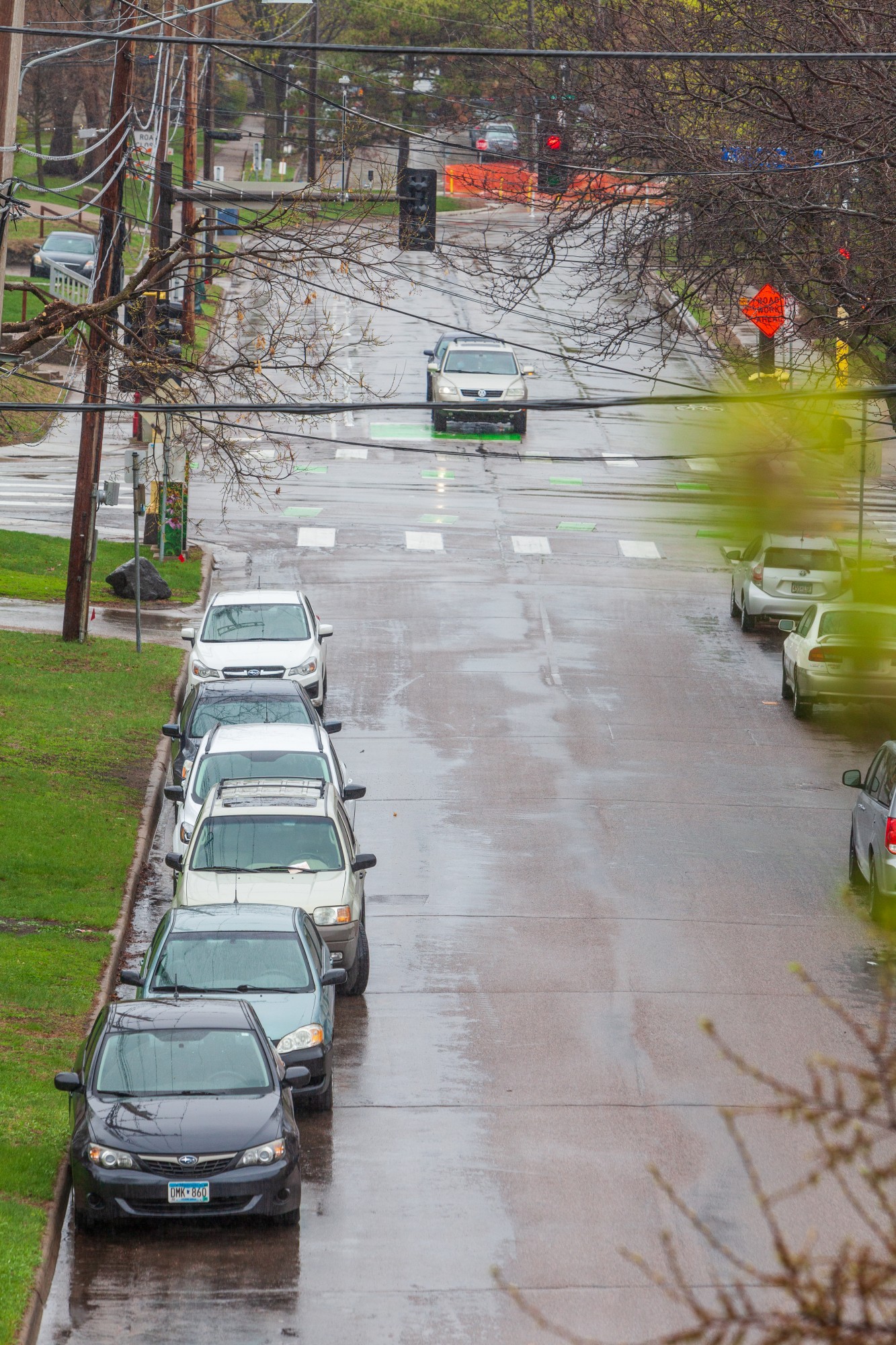 Parked cars line a residential street in the Como neighborhood on Tuesday, April 28.