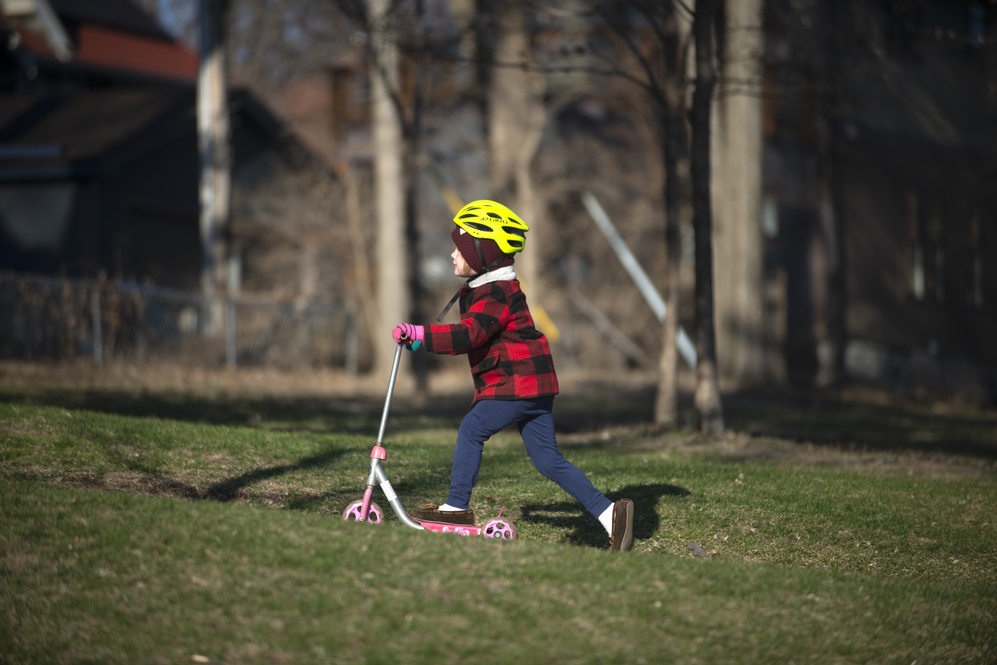 Sullivan Moran (4) rides his scooter uphill at Powderhorn park in Minneapolis on Tuesday, March 31. 
