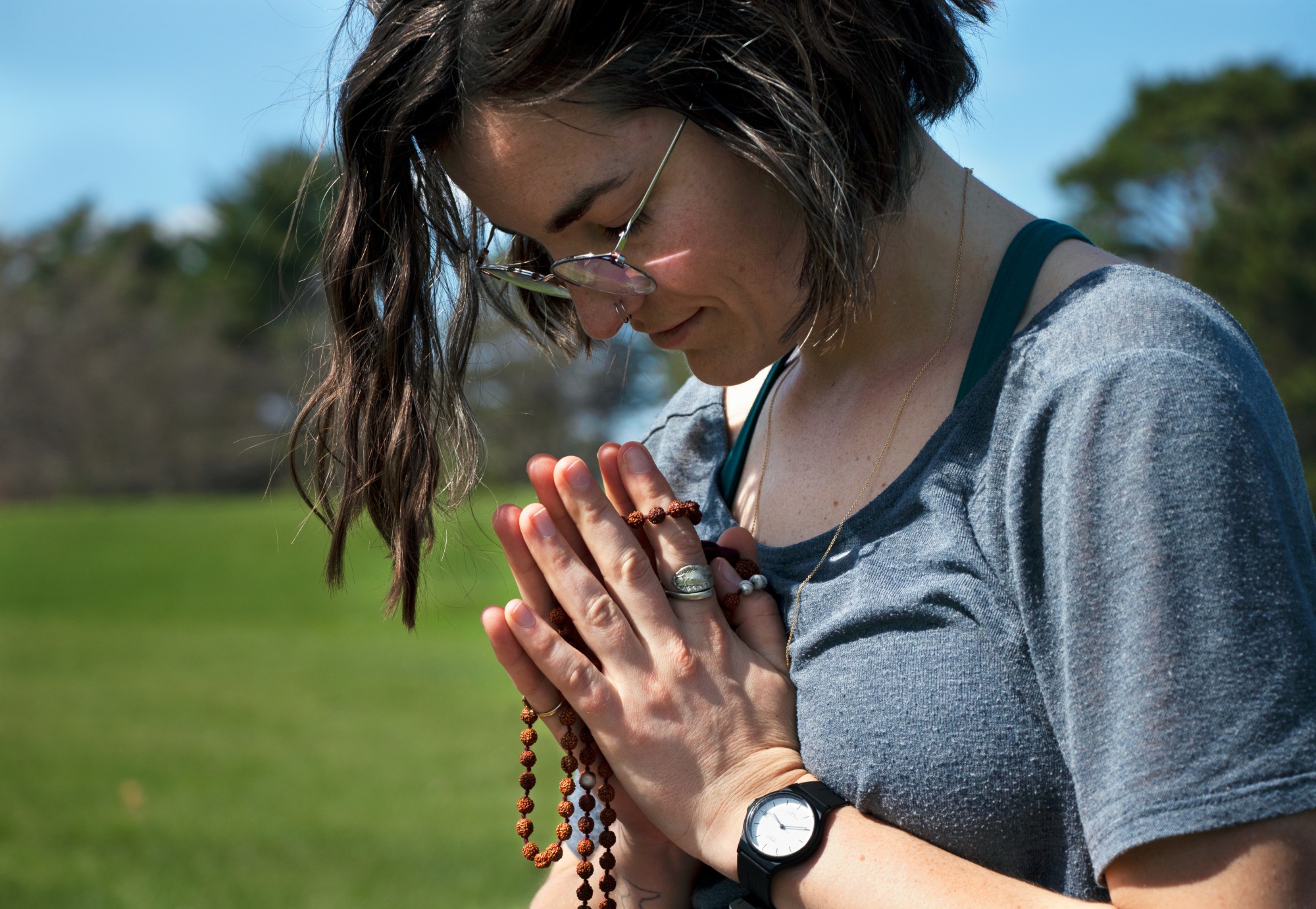 Tessa Rose meditates in Como Regional Park on Monday, April 27. As a yoga instructor, Rose believes that the mental aspects of yoga are often more important than the physical. 