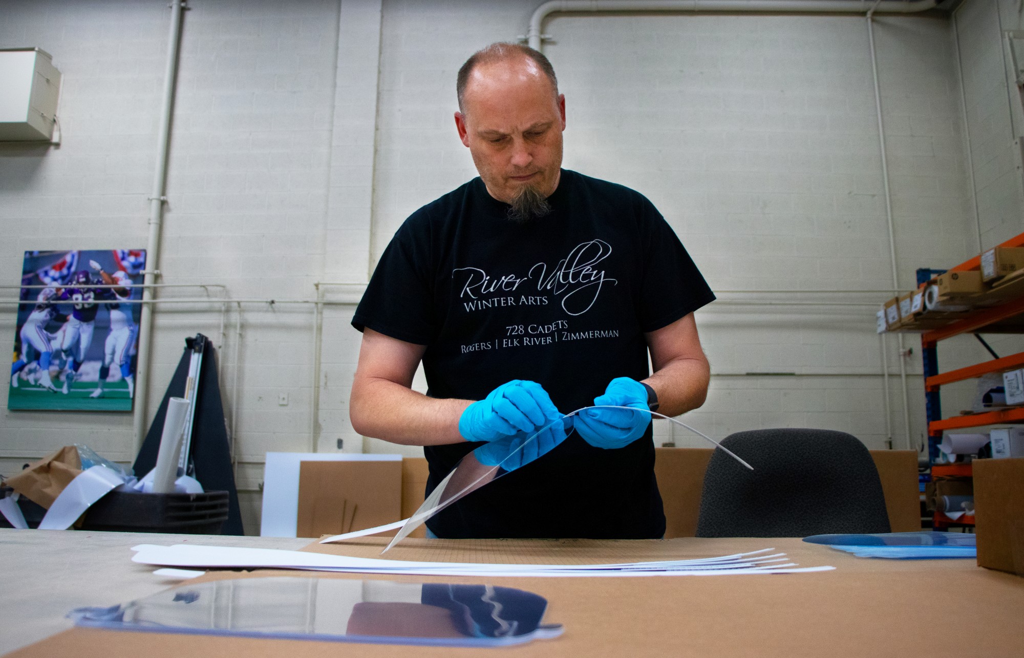 Jeff Kern, the large format manager at Bolger, assembles acrylic face shields at Bolger’s facility in St. Paul on Friday, May 1. 