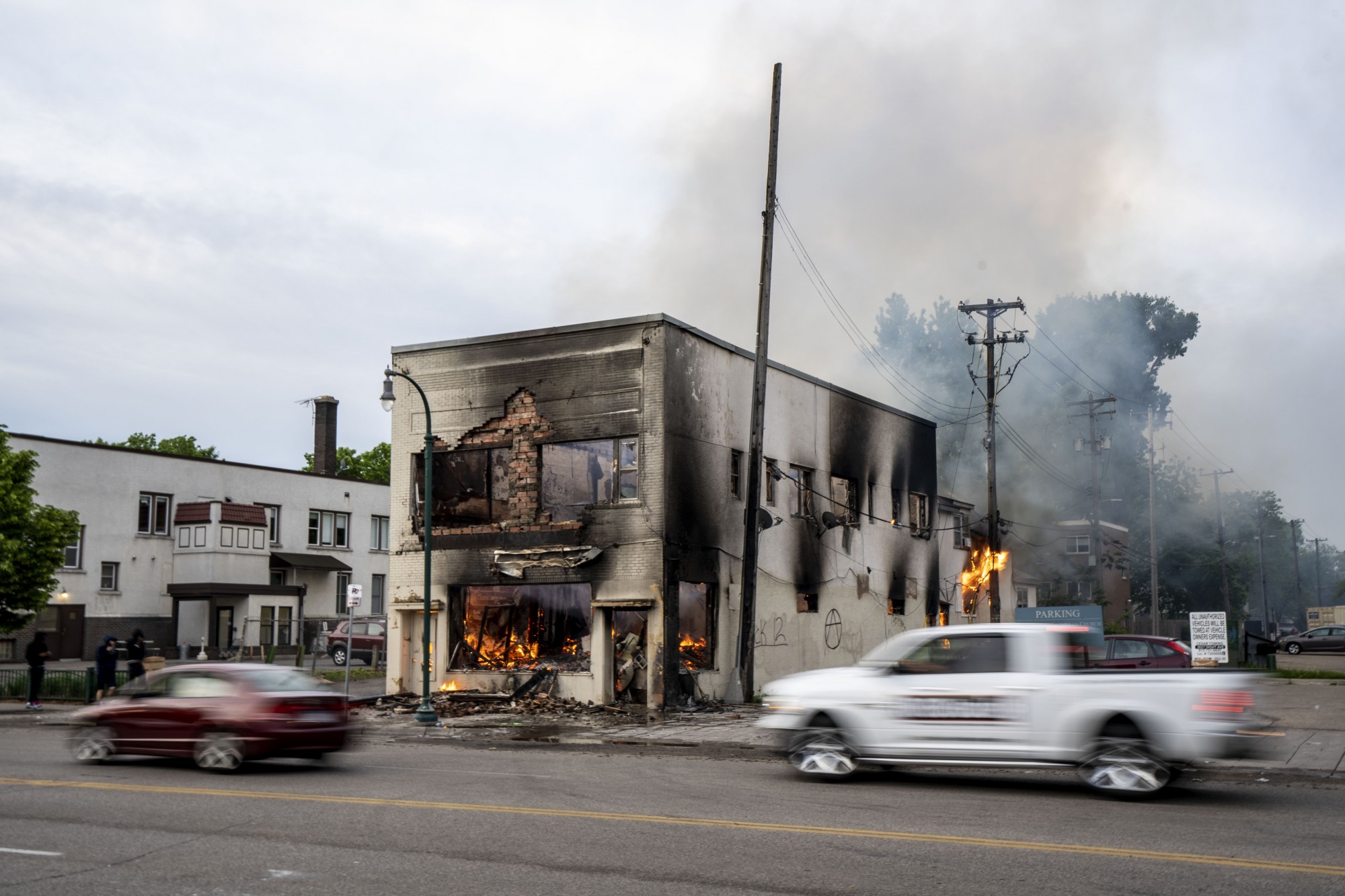 A burned out building is seen the morning after a second night of protests that turned violent near the Minneapolis Police 3rd Precinct following the death of George Floyd. Dozens of businesses were vandalized and firefighters were still working to control several blazes still at hand on Thursday, May 28. 