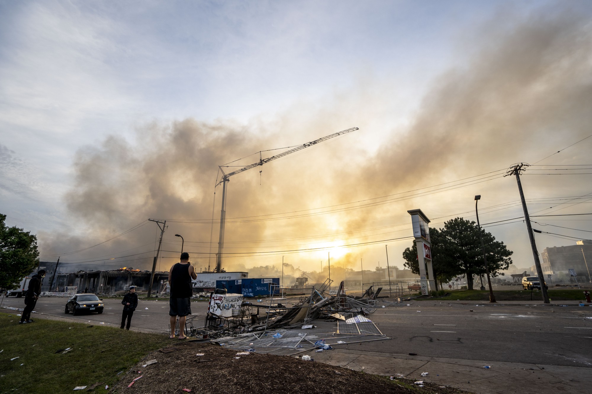 Smoke rises the morning after a second night of protests that turned violent near the Minneapolis Police 3rd Precinct following the death of George Floyd. Dozens of businesses were vandalized, and firefighters were still working to control several blazes still at hand Thursday, May 28. 