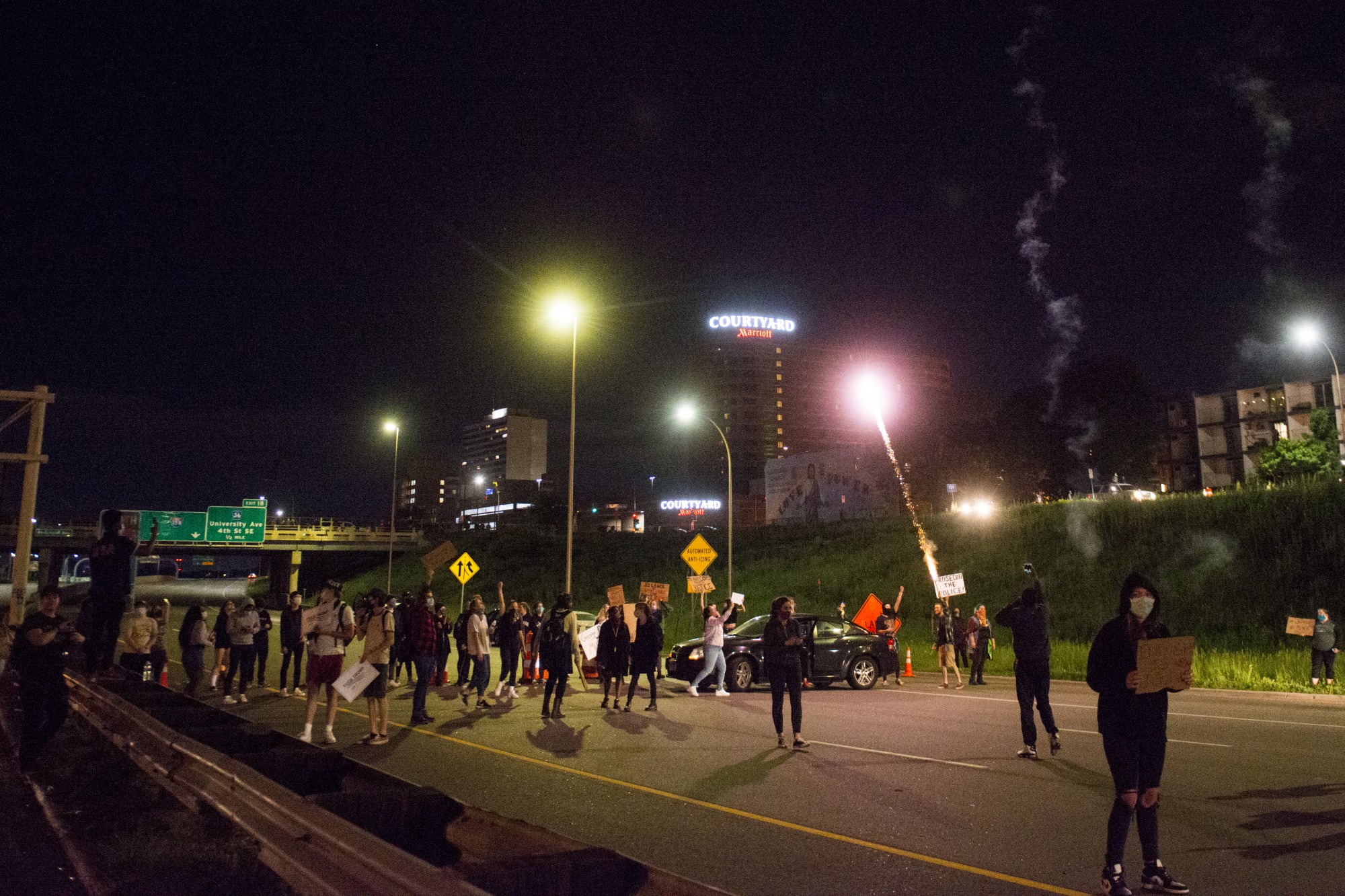 Protestors erect a barricade to block traffic on Interstate 35W on Friday, May 29. 