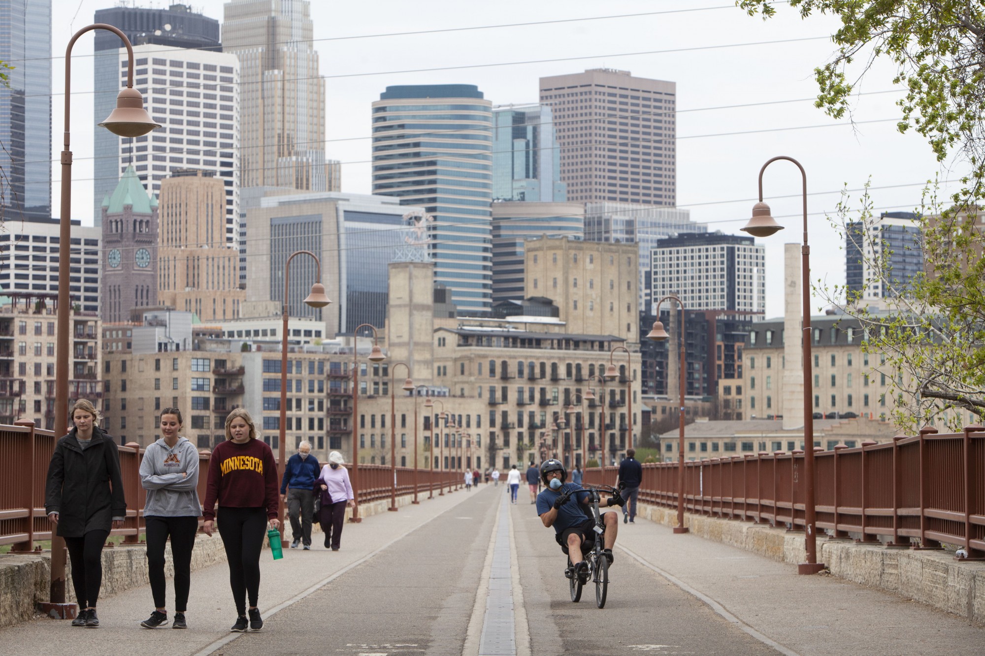 12:06 p.m.
Pedestrians run, bike, and walk across the Stone Arch Bridge. 