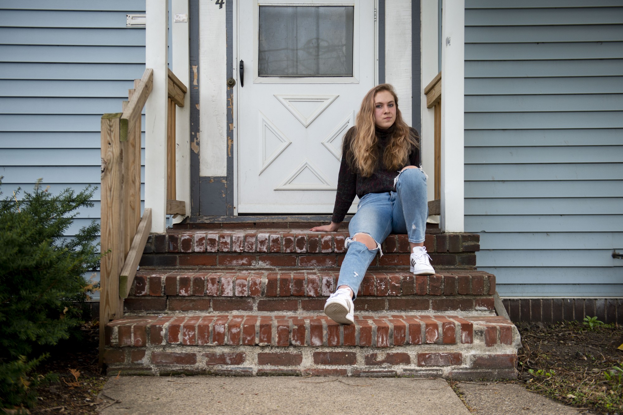 6:10 p.m.
Mary Clare OShea, who returned to campus to work after spending time at home once classes transitioned online, poses for a portrait on her front steps. Currently living with only one other person, The big thing for me has been realizing how important human connection is, she said. 
